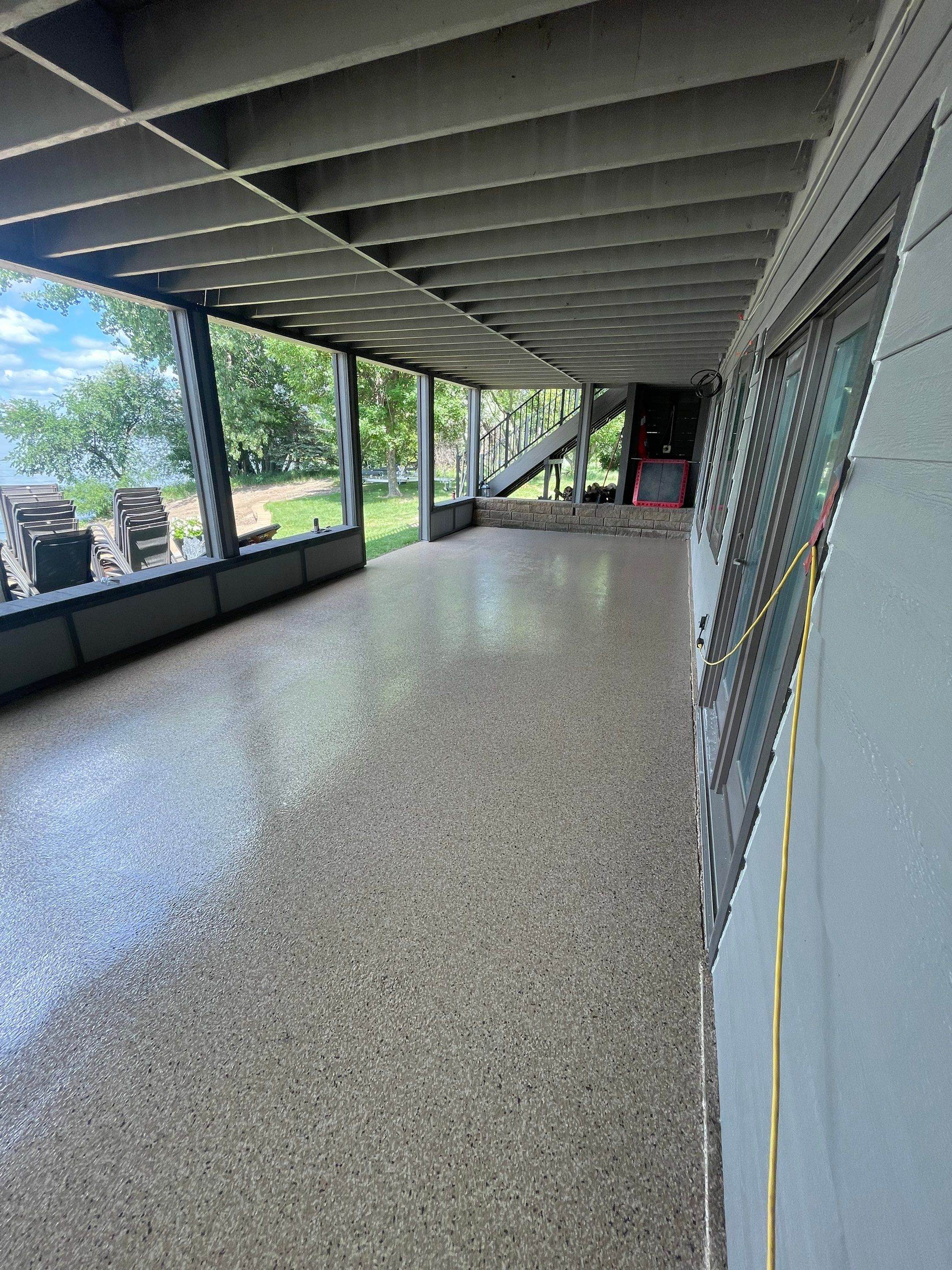Lakefront Screened Patio Concrete Coating Installation in Wentworth by Select Painting, Coatings & Garage Cabinets