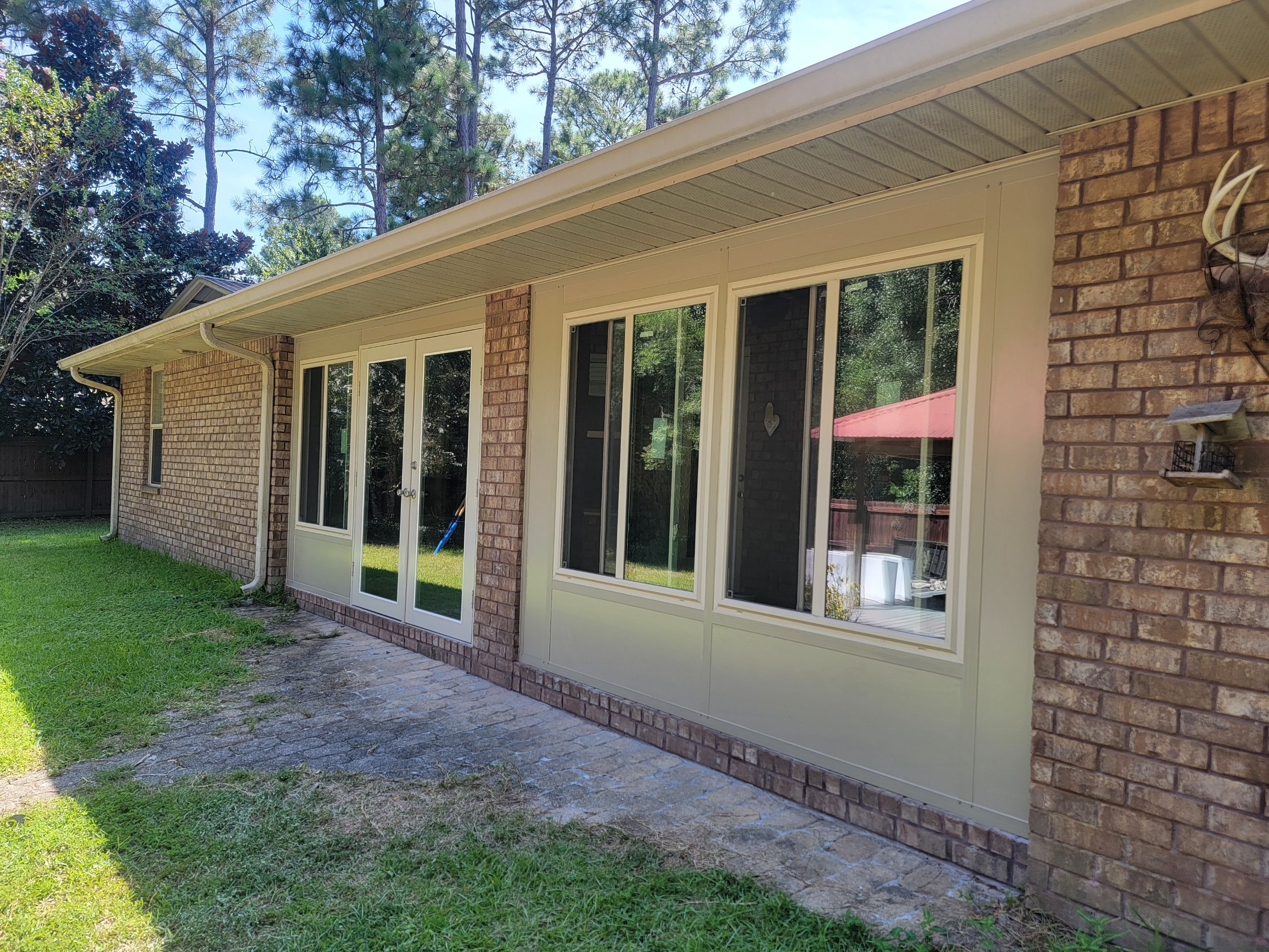 Glass Sunroom Constructed Under Existing Roof by Titan Sunrooms