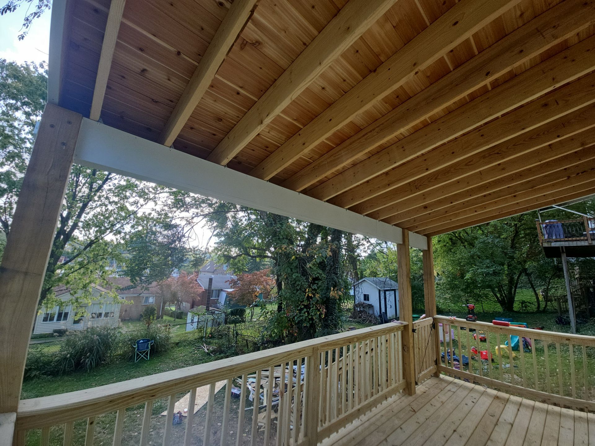 Deck and shed roof by Cousins Roofing Siding & Decks