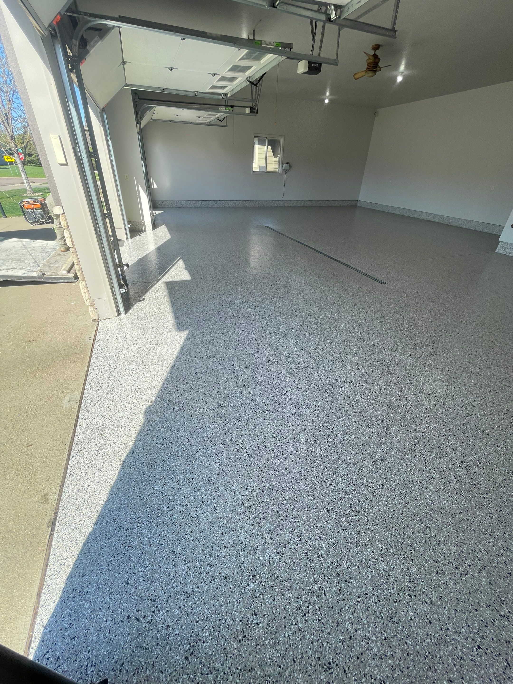 Multi-Car Garage Epoxy Floor Coating in Beresford by Select Painting, Coatings & Garage Cabinets