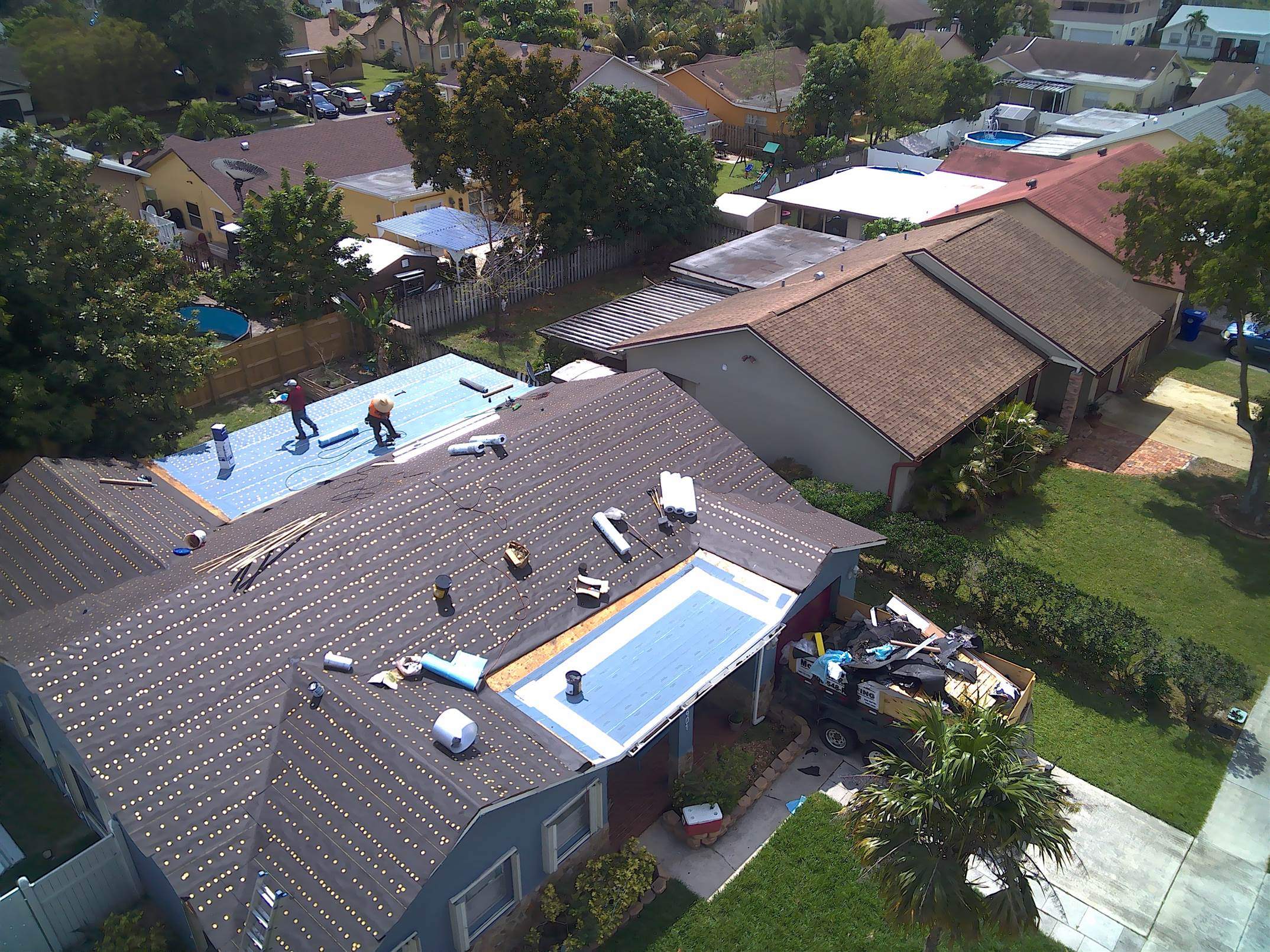 Standing Seam Metal & Flat Re-Roof using 1.5" Nail Strip 24ga Solar White Kynar Coated Standing Seam Metal Panels by Morton Roofing, Inc.