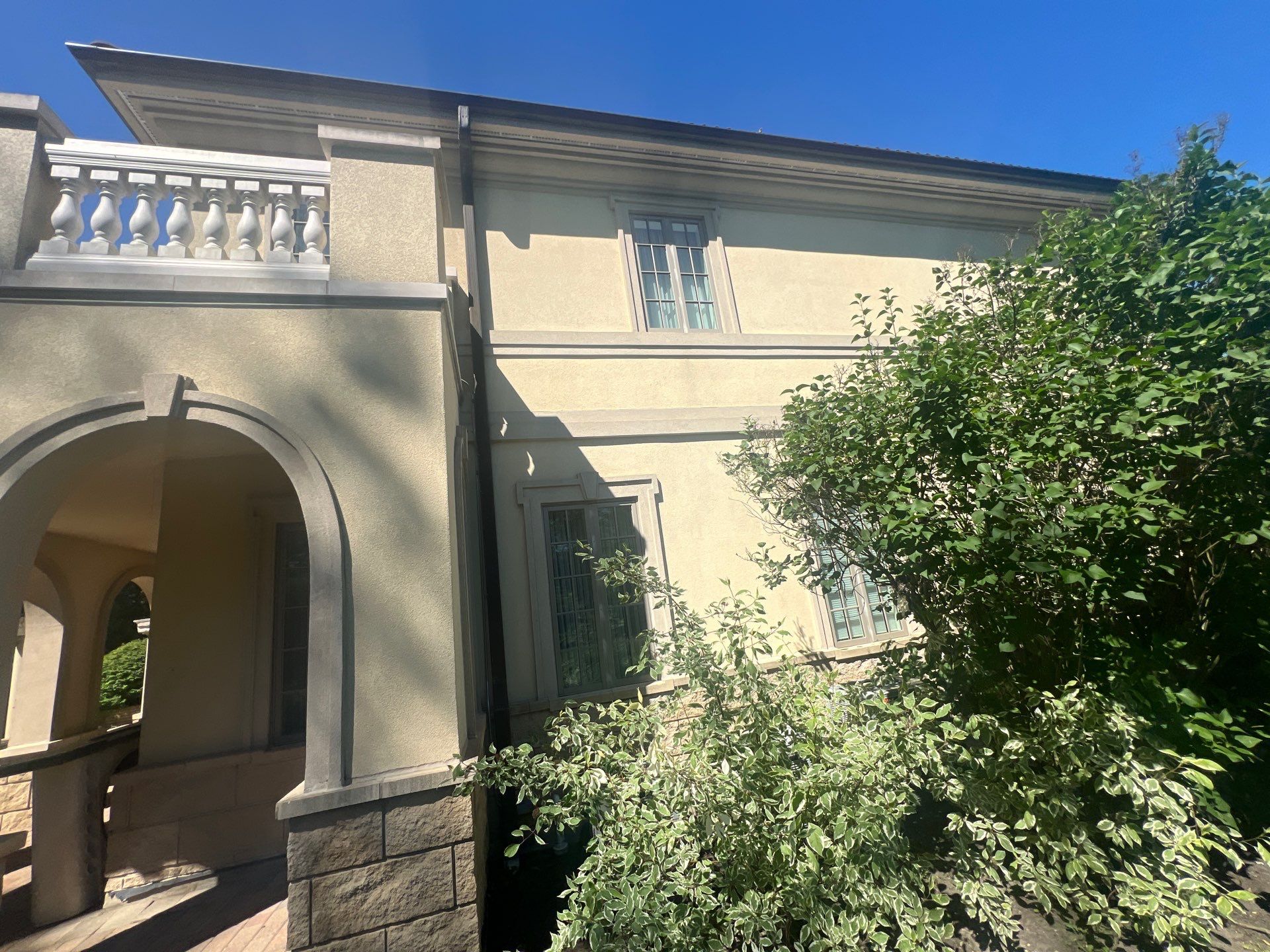 concrete cleaning using Algaecide, soft wash soap by Northern Power Washing LLC.