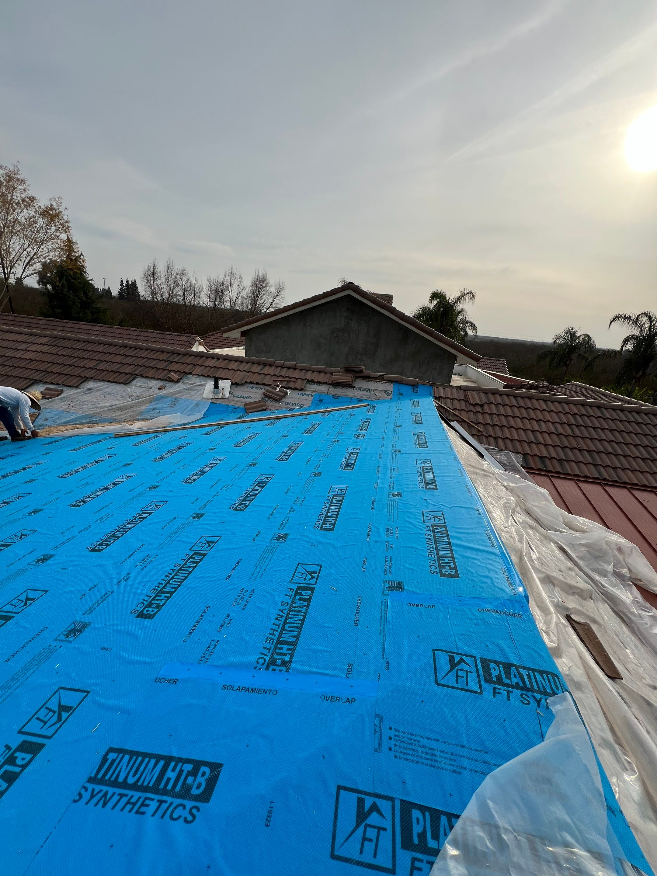 Tile, Metal, and TPO roofing project (new construction) by Straight Edge Roofing Inc