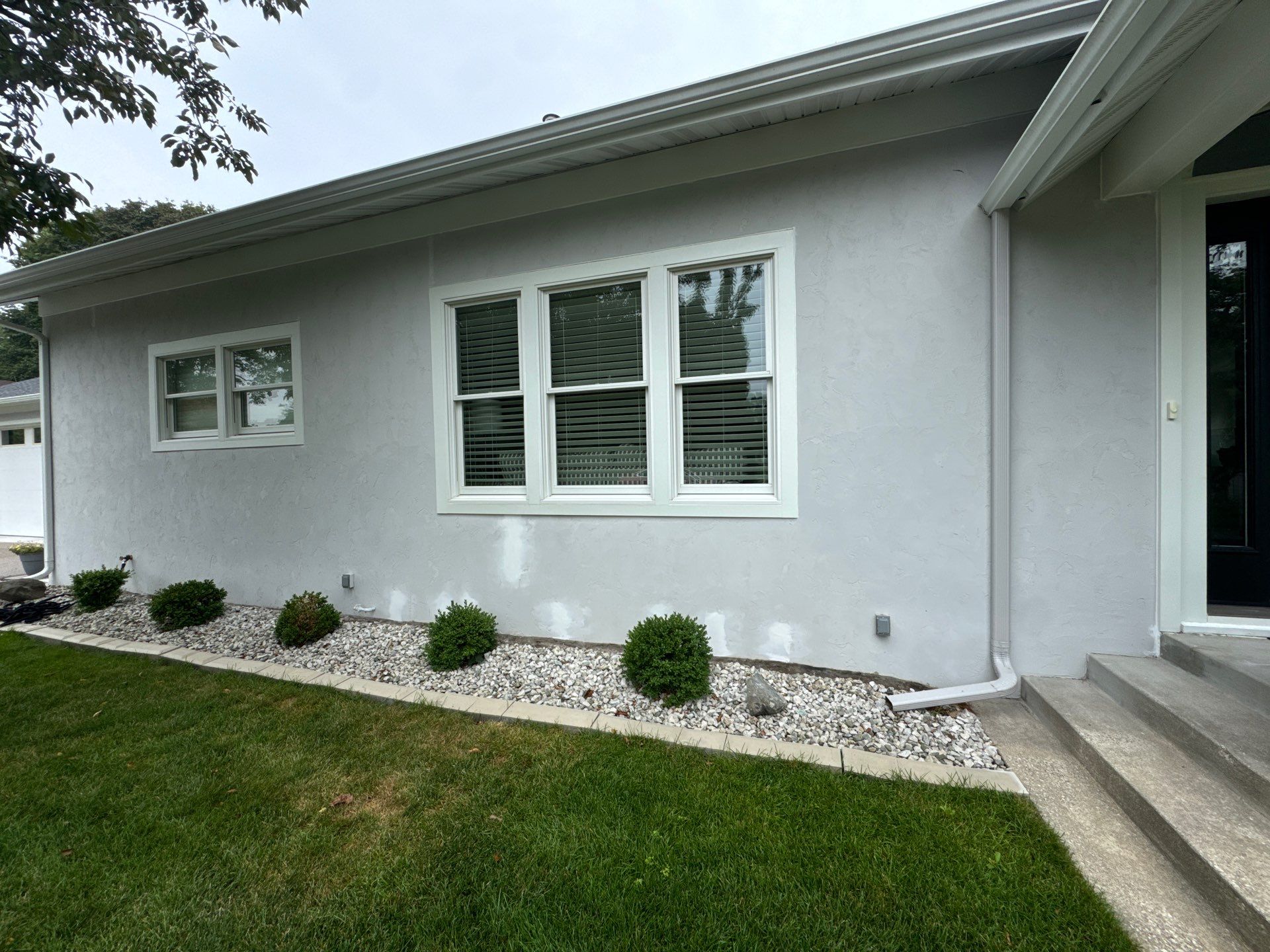 Norton Shores Residential Stucco Repair and Exterior Painting Refresh by Gordon Painting