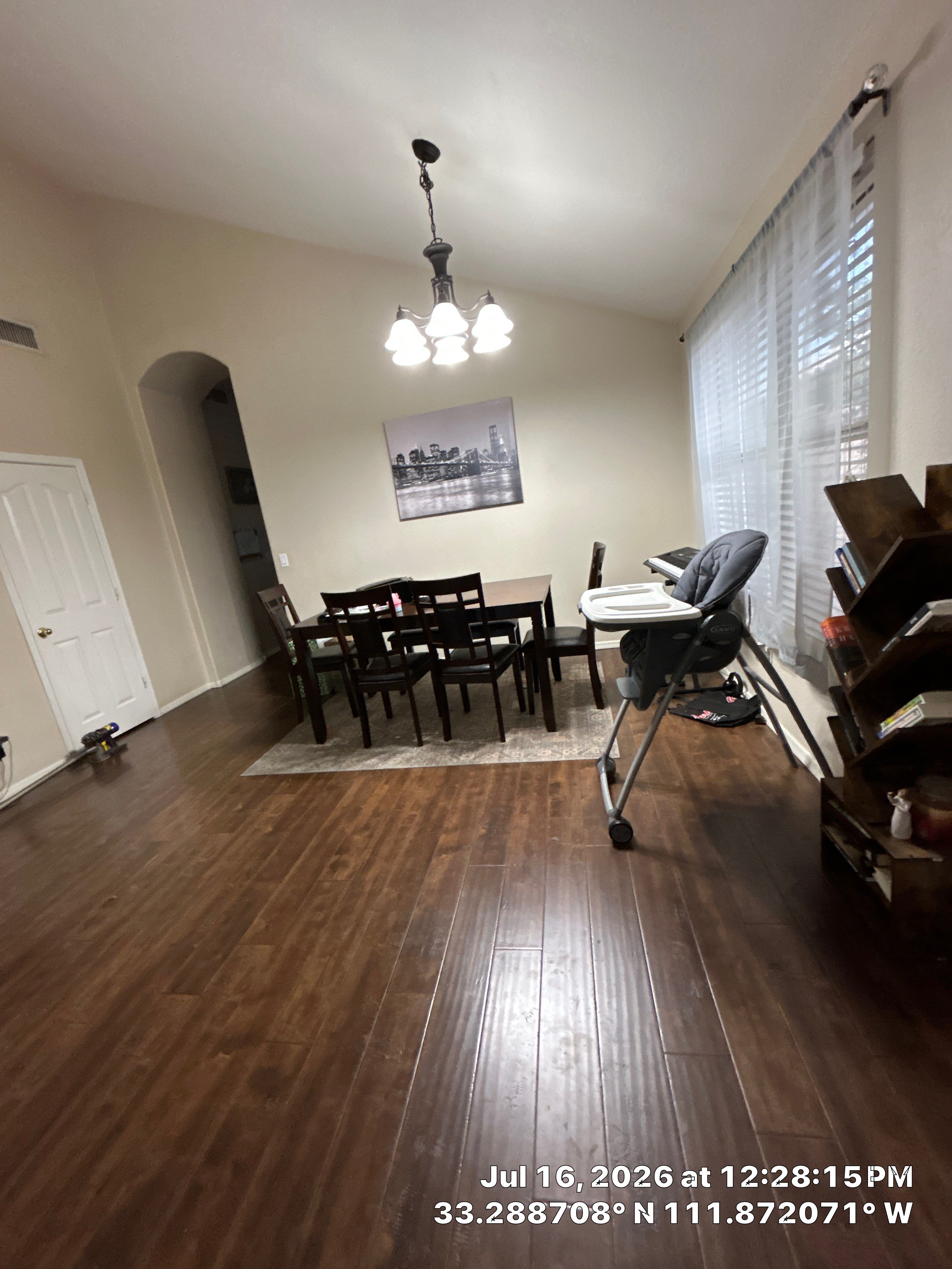 Dark Wood Laminate Flooring Installation for Chandler Dining Room by CompanyCam Sales Demo