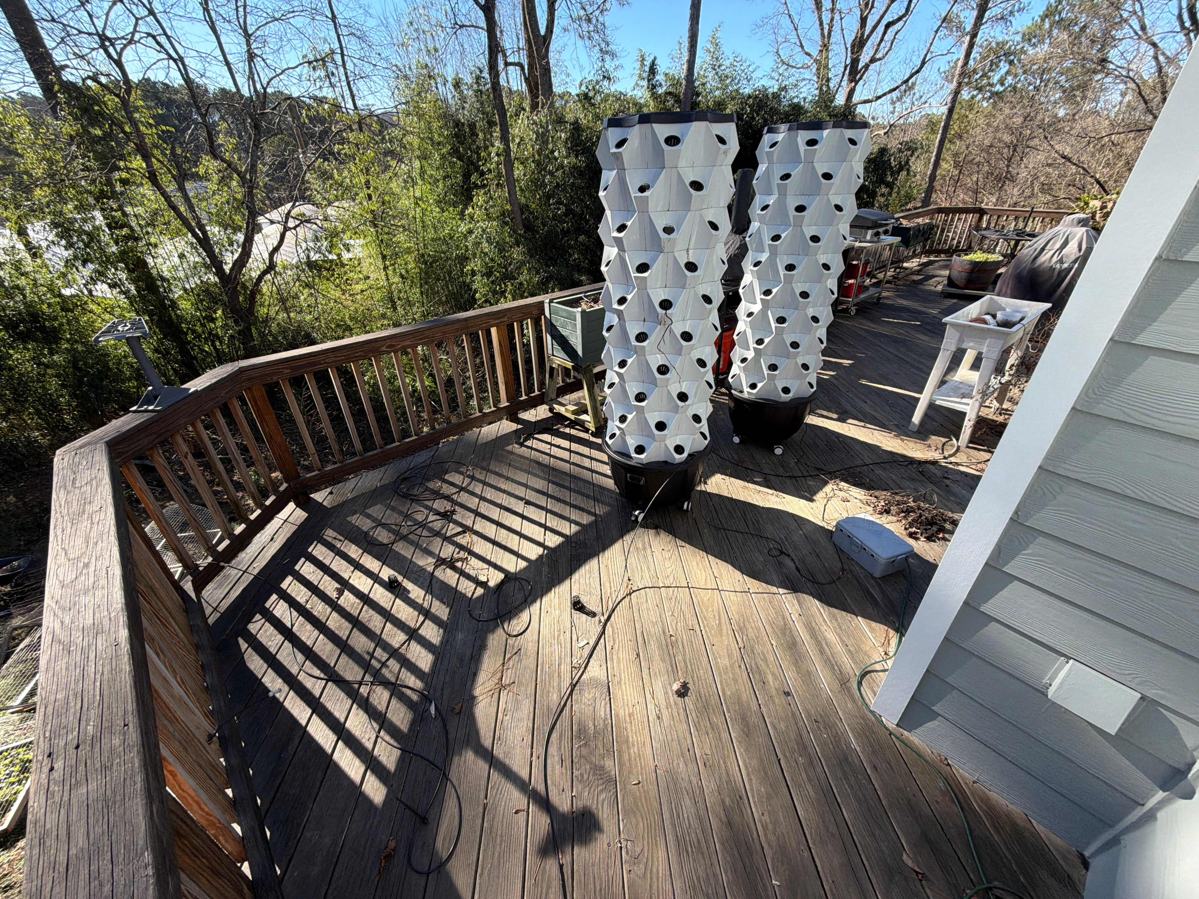 Covered Porch and Deck Build using Deckorators Venture Series Decking and Trex Select Aluminum Railing by Nelson Exteriors