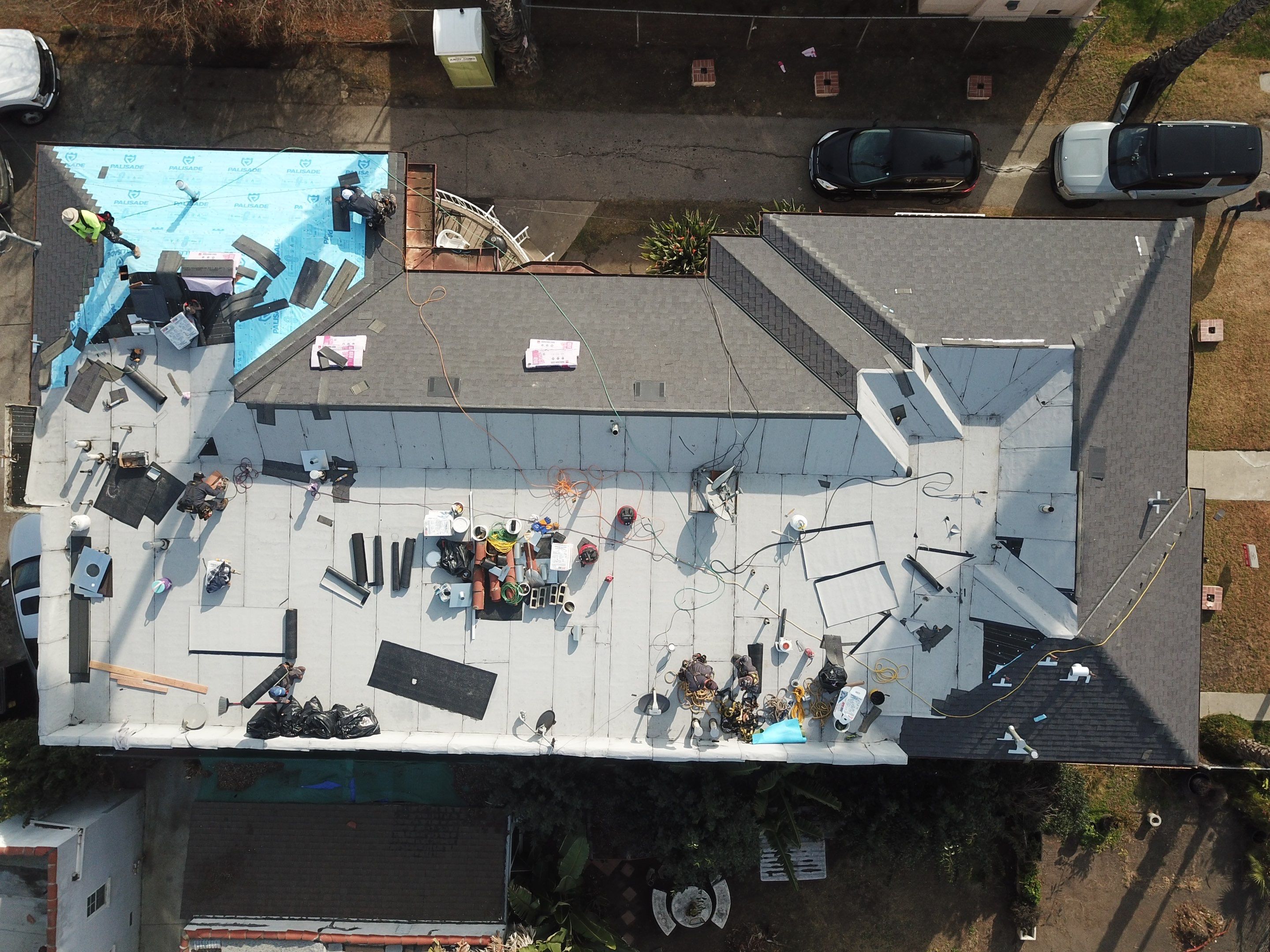 Apartment Building Roofing Installation using CertainTeed GTA Modified Bitument System by Hull Brothers Roofing