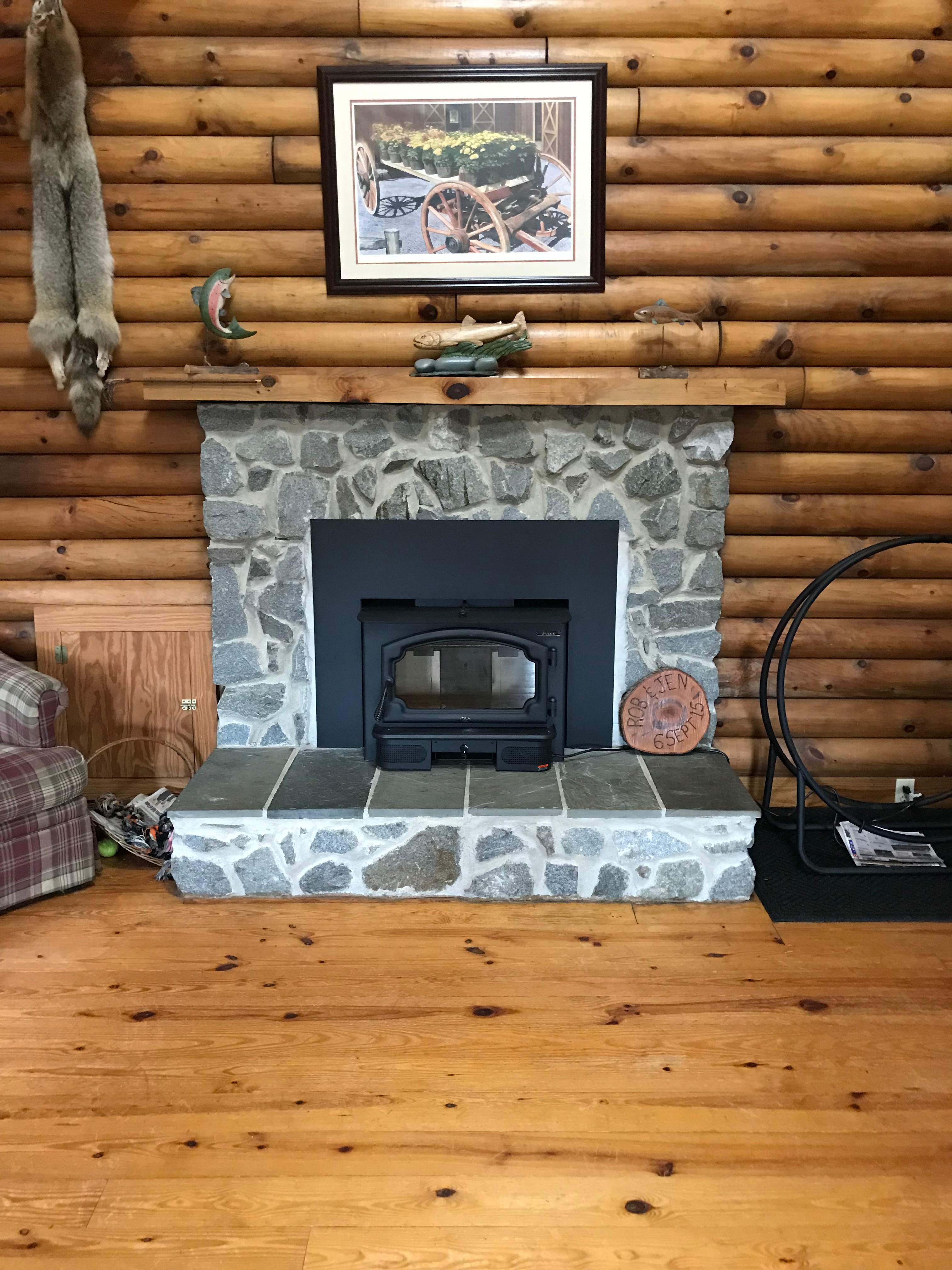 Wood Stove Insert + Stone + Mantel by Premier Chimney and Roofing