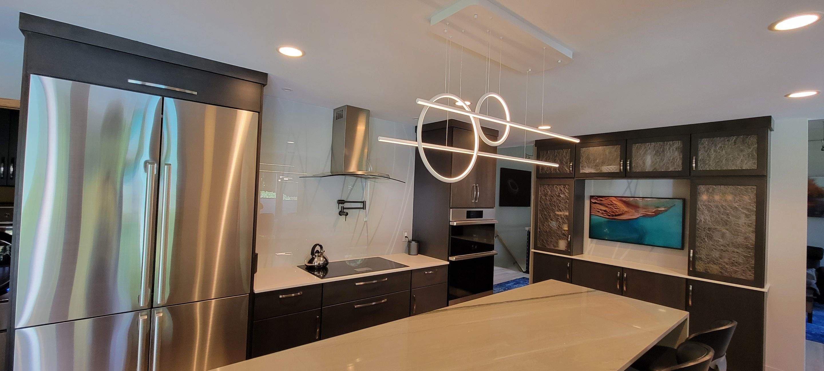 Kitchen Remodel using IMAGIO Misty Curves Solid Glass Backsplash by IMAGIO