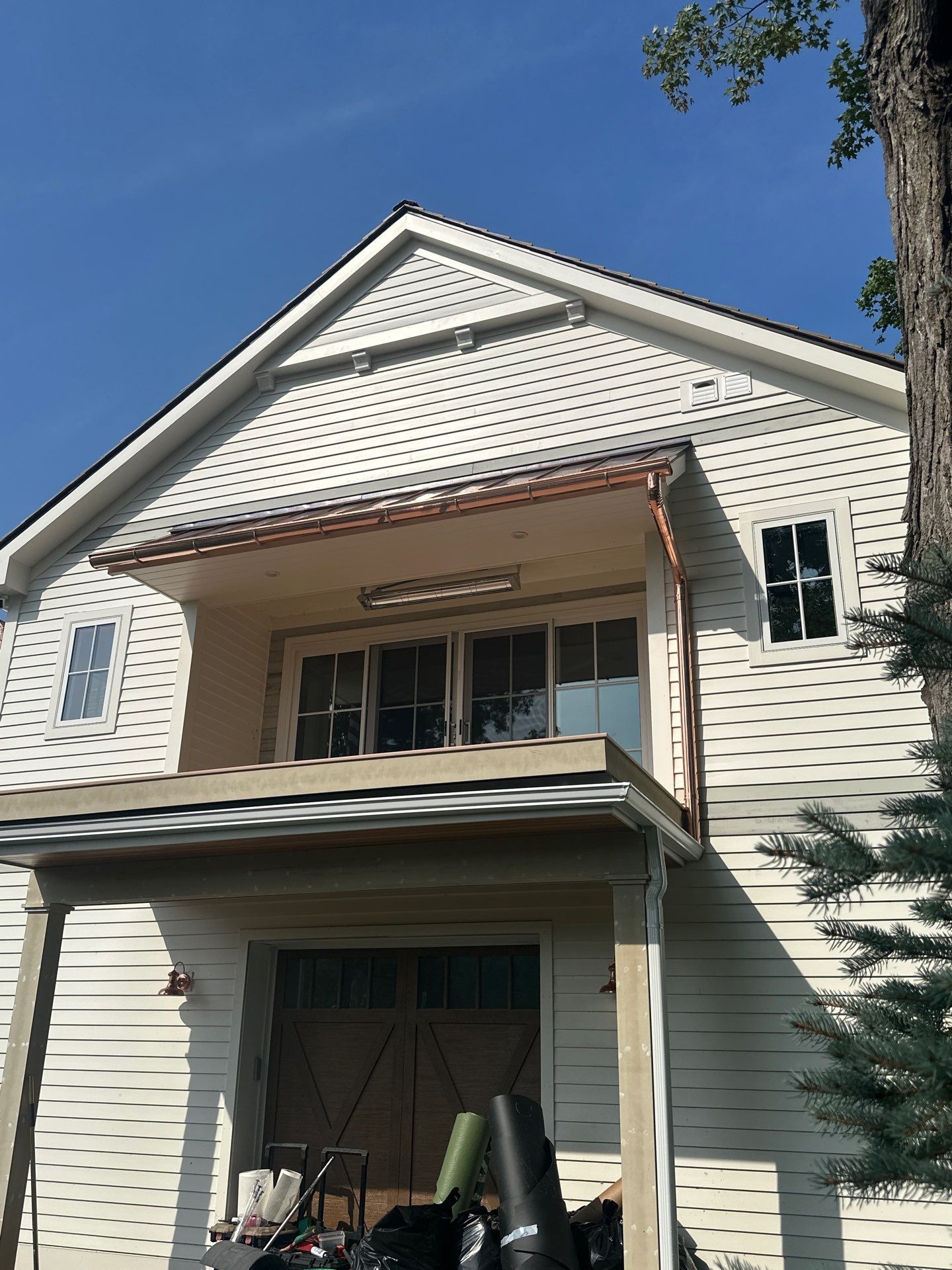 Custom Copper Gutter System and Accent Roofing in East Jordan by Rainbow Seamless Systems