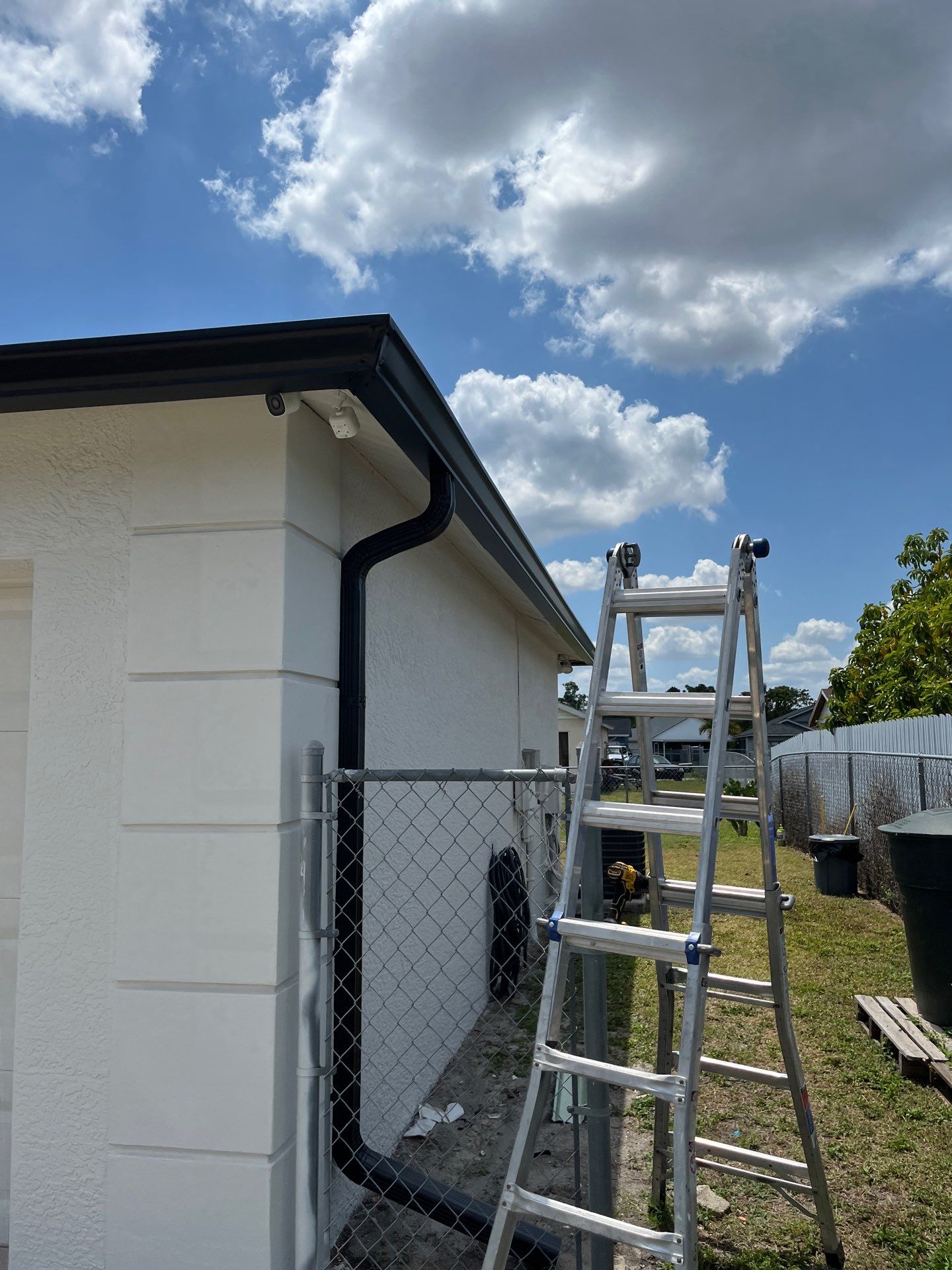 Black Seamless Gutters and Downspouts in Fort Myers FL by Gutter Professors