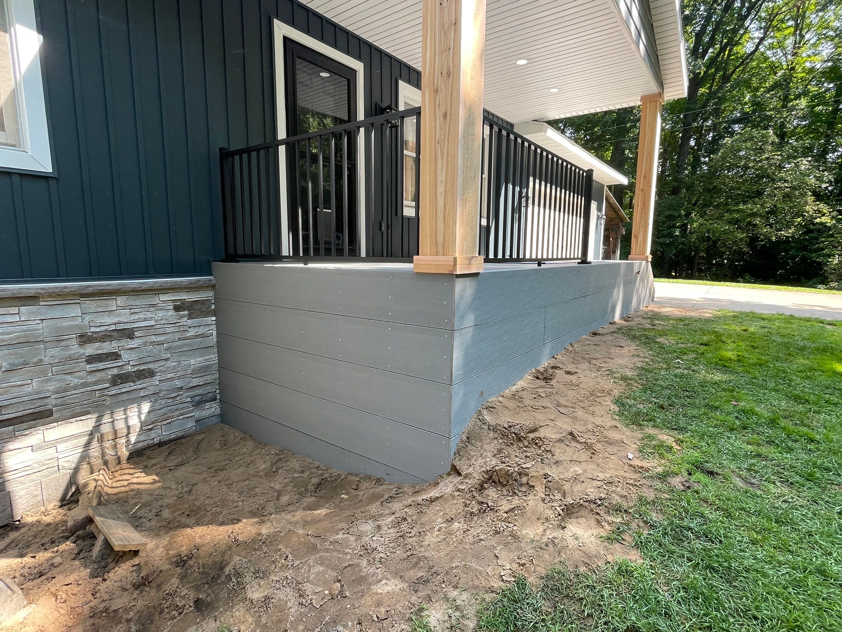 Siding, Deck and Versetta Stone by Avalon Roofing and Exteriors