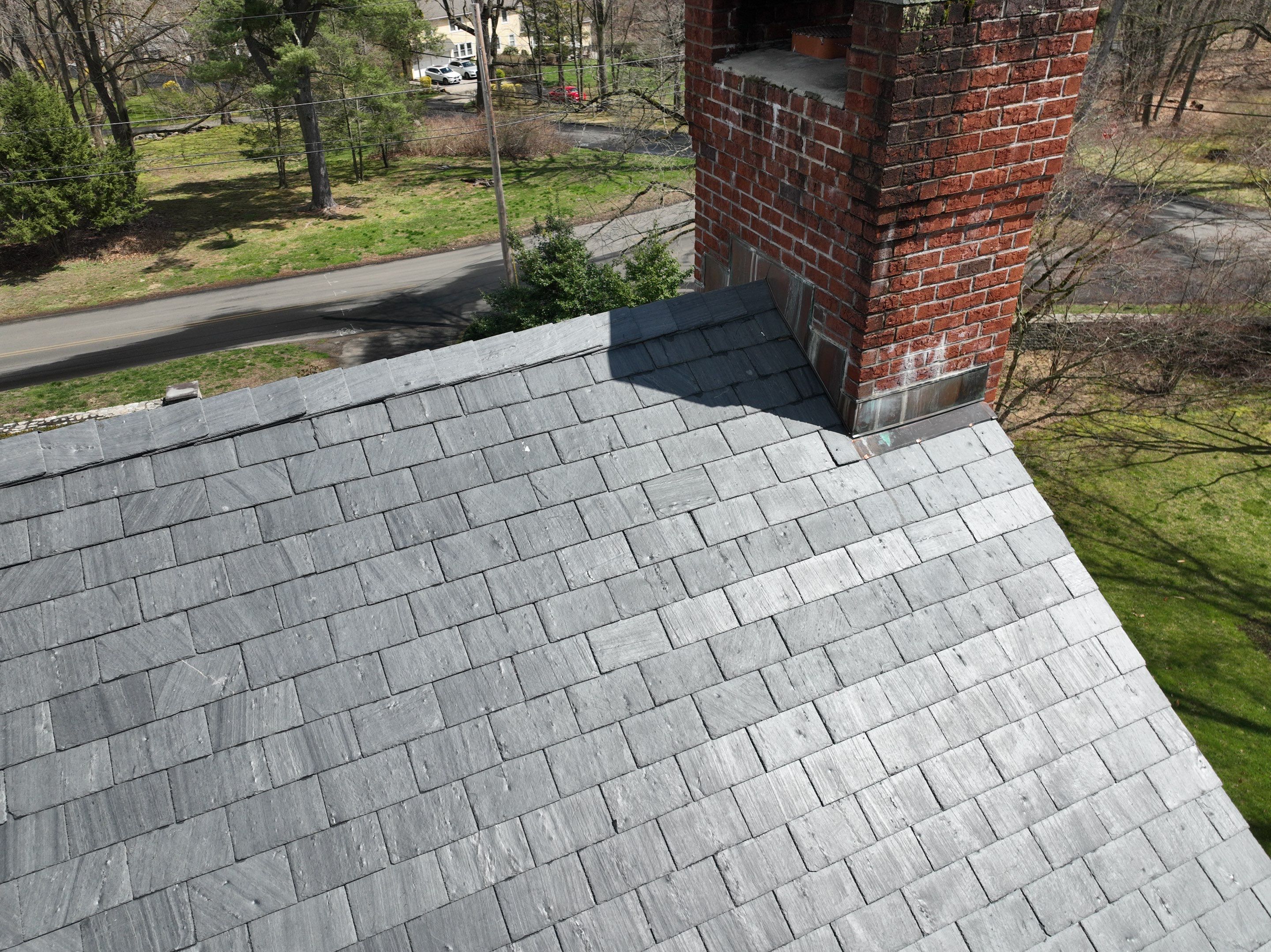 Residential Roofing Installation using Vermont Slate by A Plus Exterior