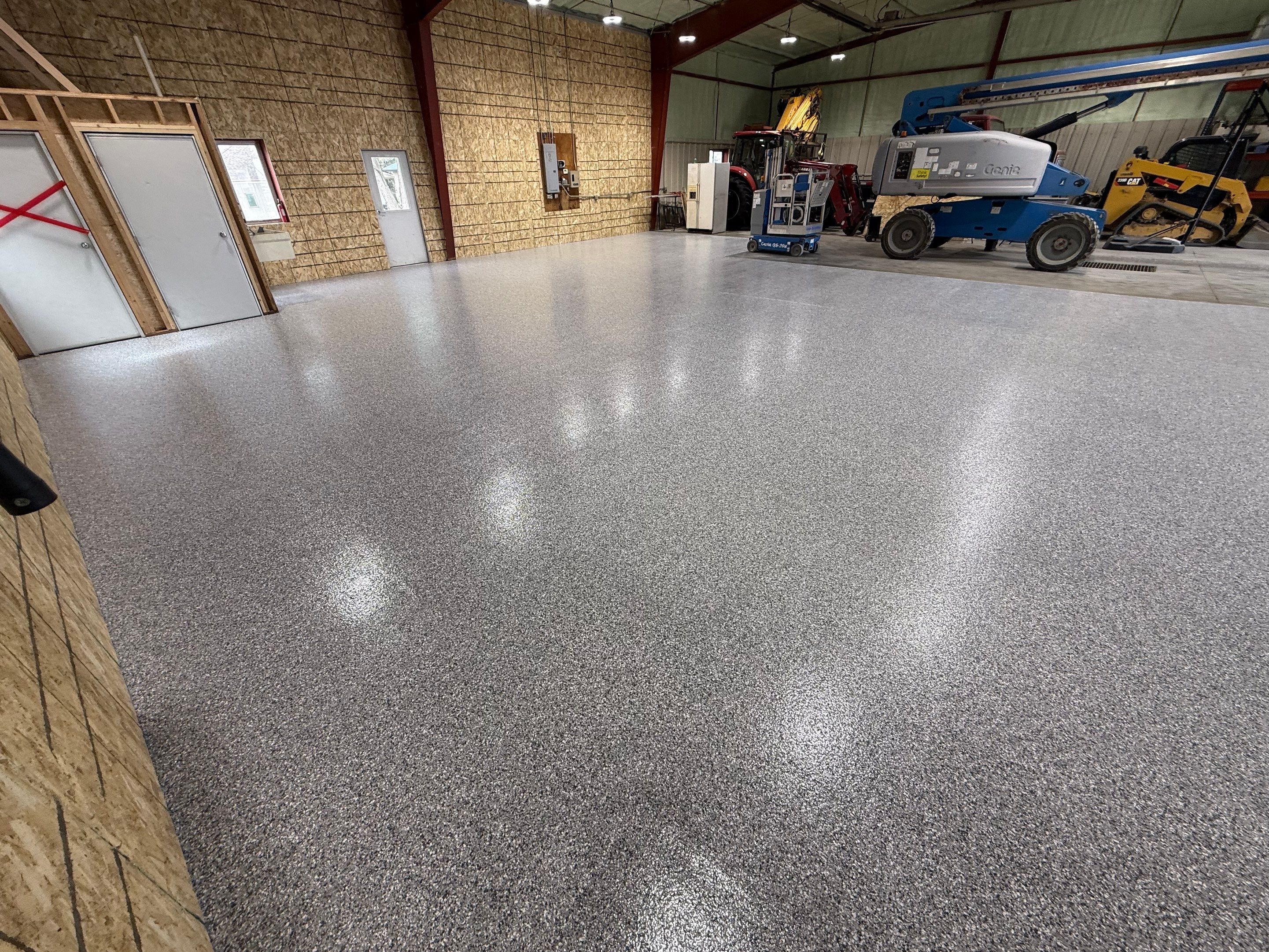 Custom Polyurea Shop Floor with Basketball Court Lines in Rock Valley by Select Painting, Coatings & Garage Cabinets