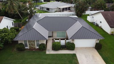 Residential Roofing Installation using 1" Nail strip metal roof