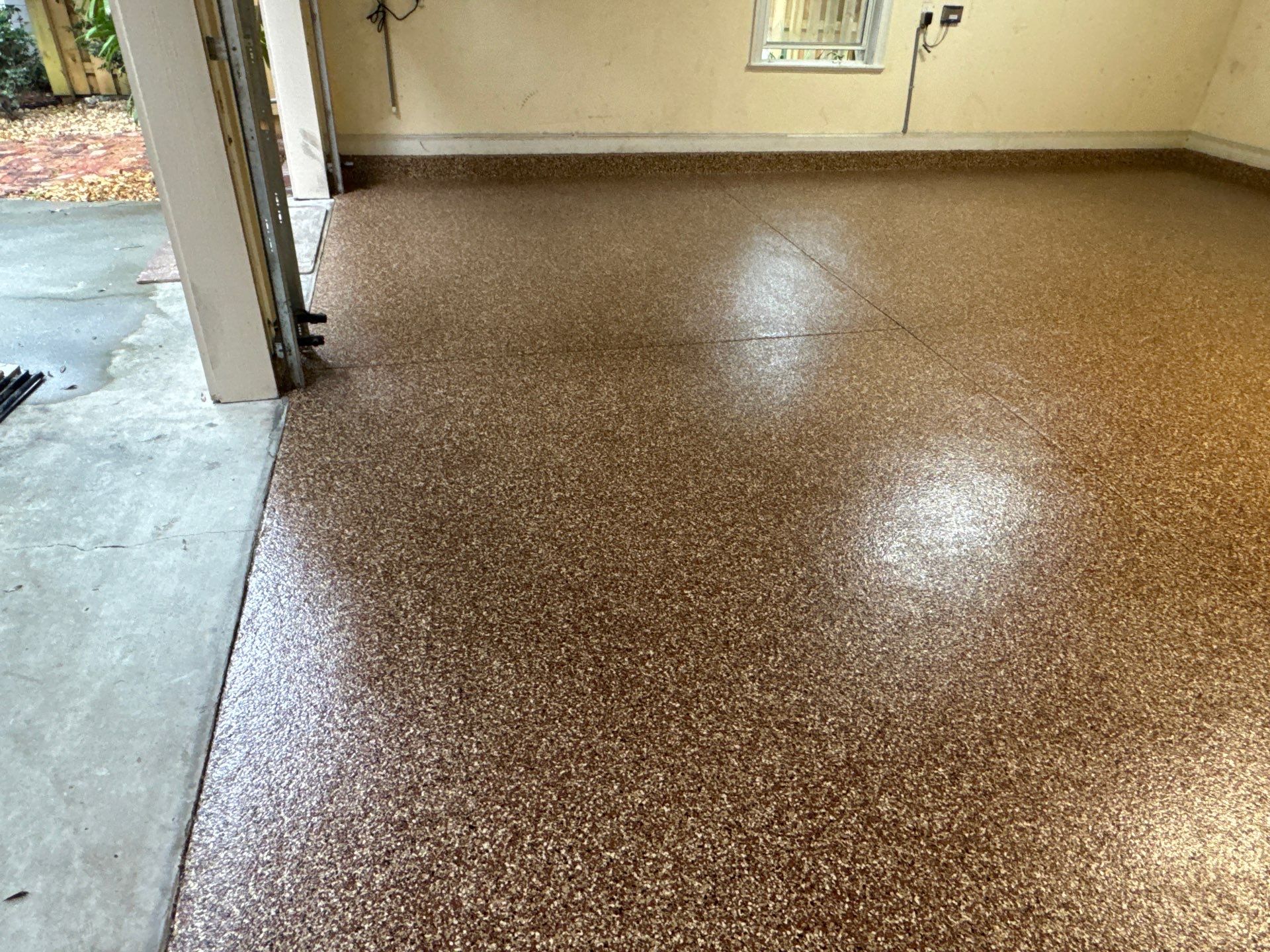 Garage Project in Newberry, FL in Chestnut by Cross Creek Concrete Coatings