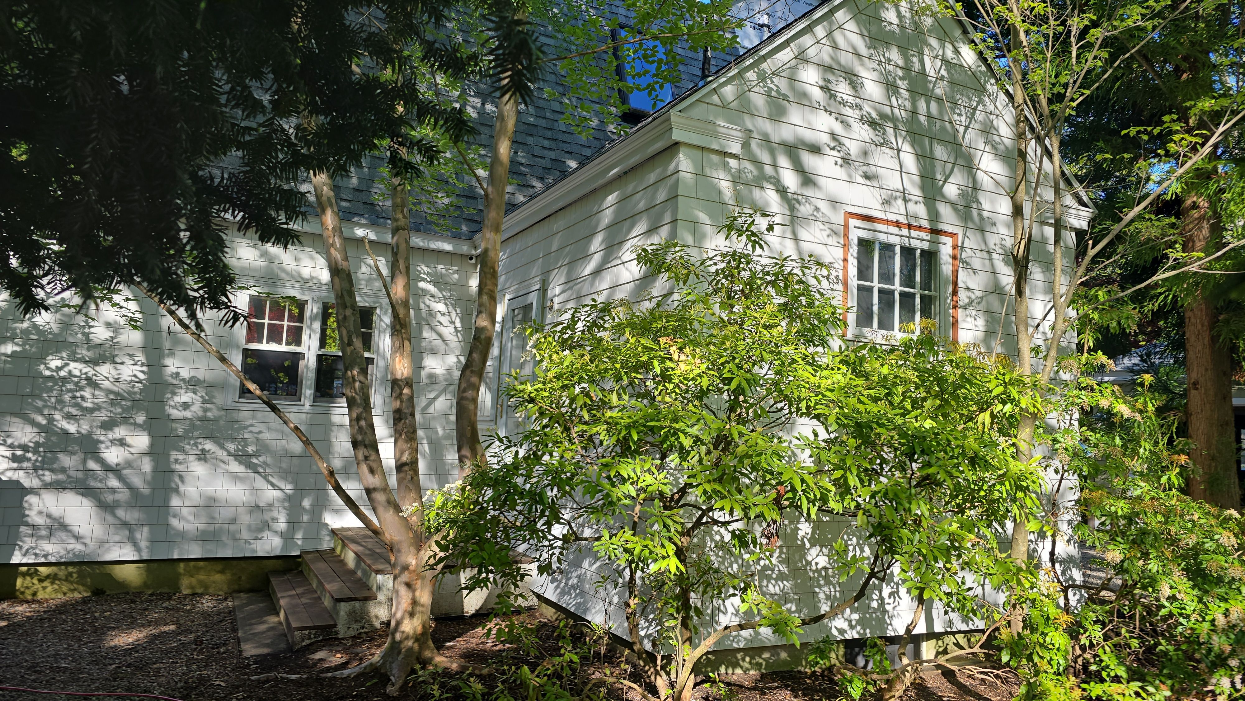 White cedar shingles and windows in Wayland, MA by UBrothers Construction