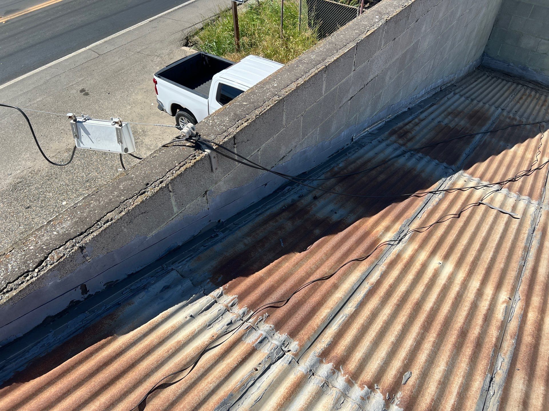 Spray foam and coatings using Conklin Benchmark/ PUMA XL acrylic coatings over metal and foam by Straight Edge Roofing Inc