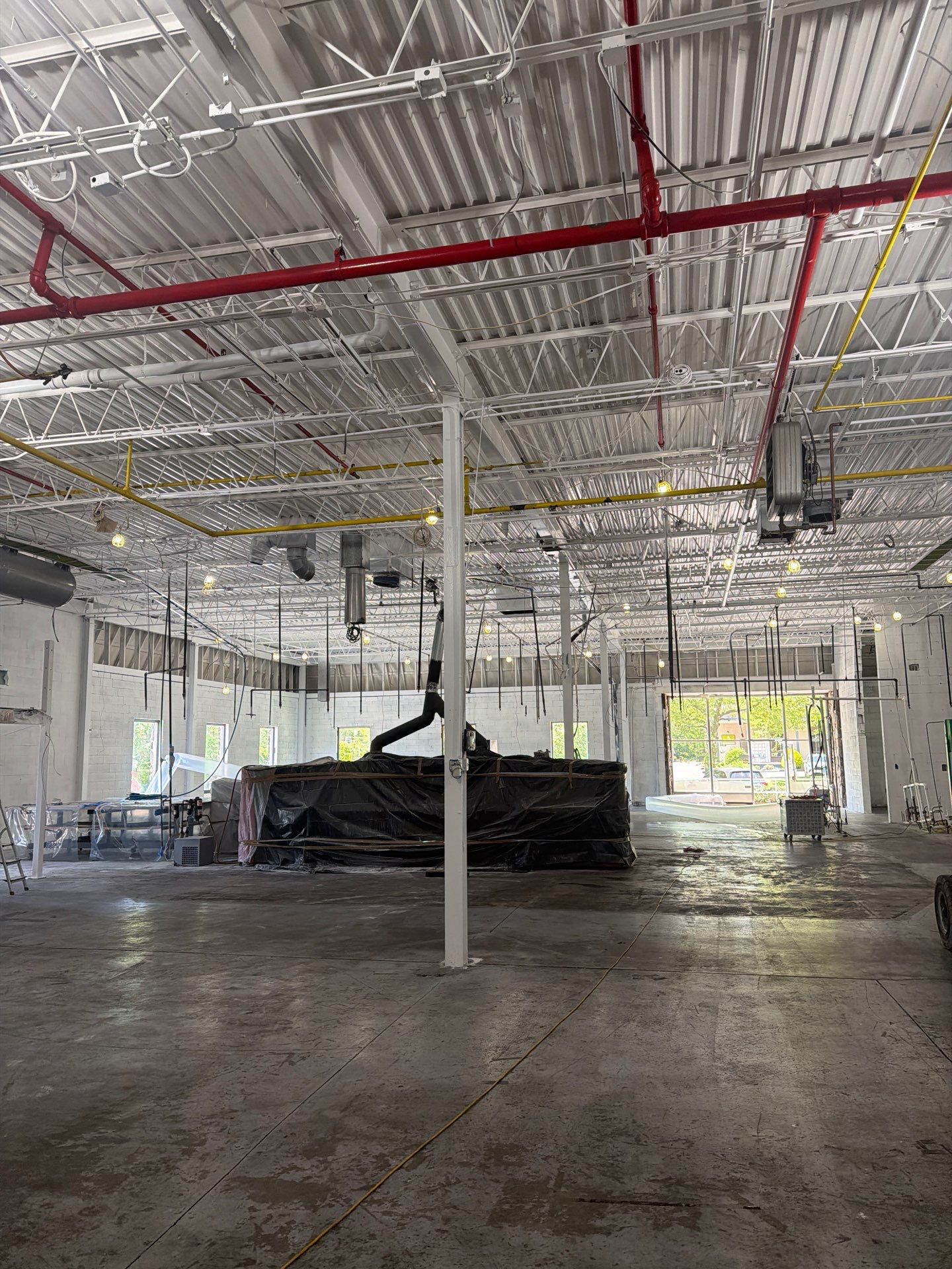 Industrial Warehouse Fire Damage Cleaning and Spray Sealing in Islandia by EMS Restoration Corp