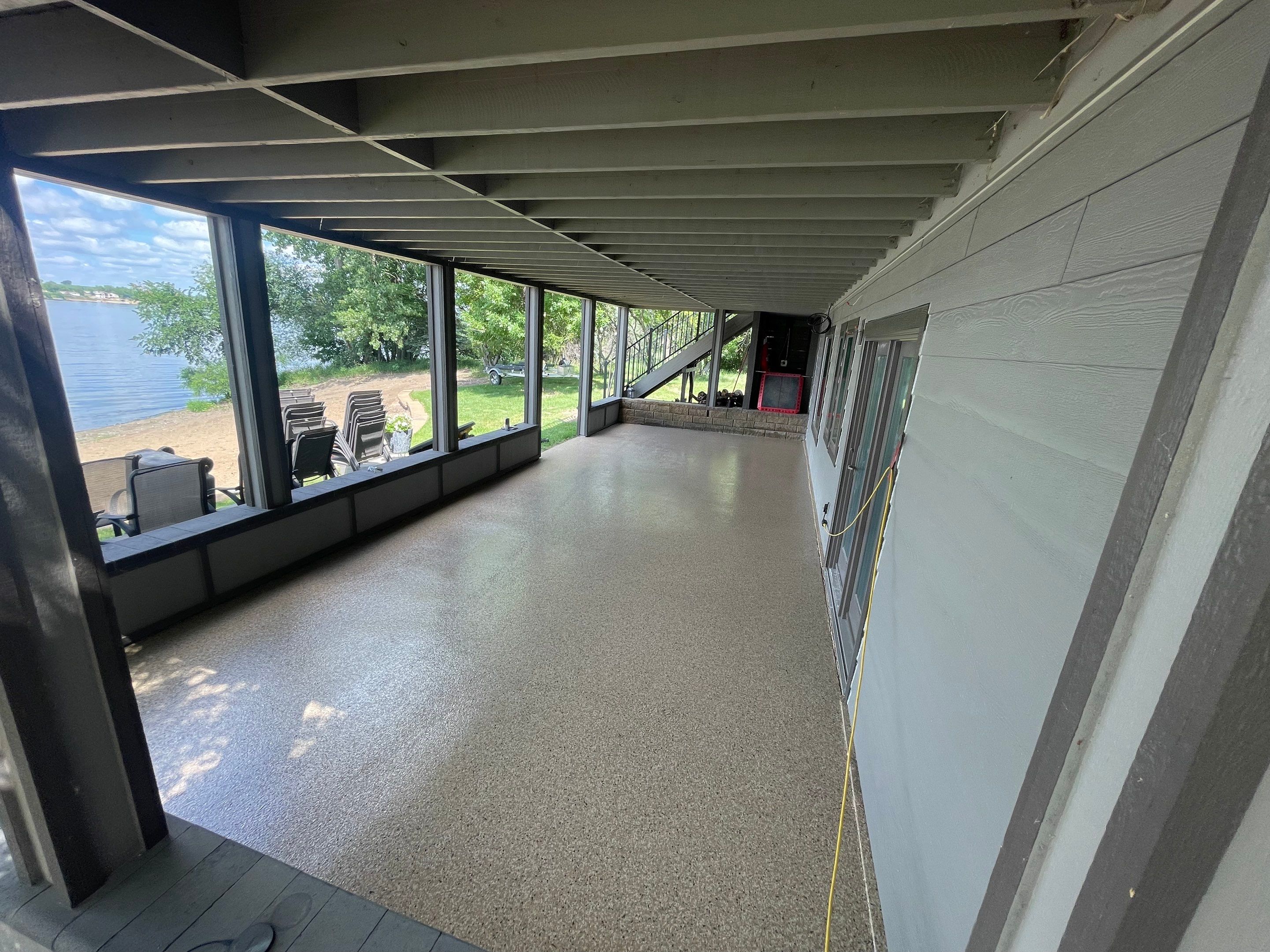 Lakefront Screened Patio Concrete Coating Installation in Wentworth by Select Painting, Coatings & Garage Cabinets