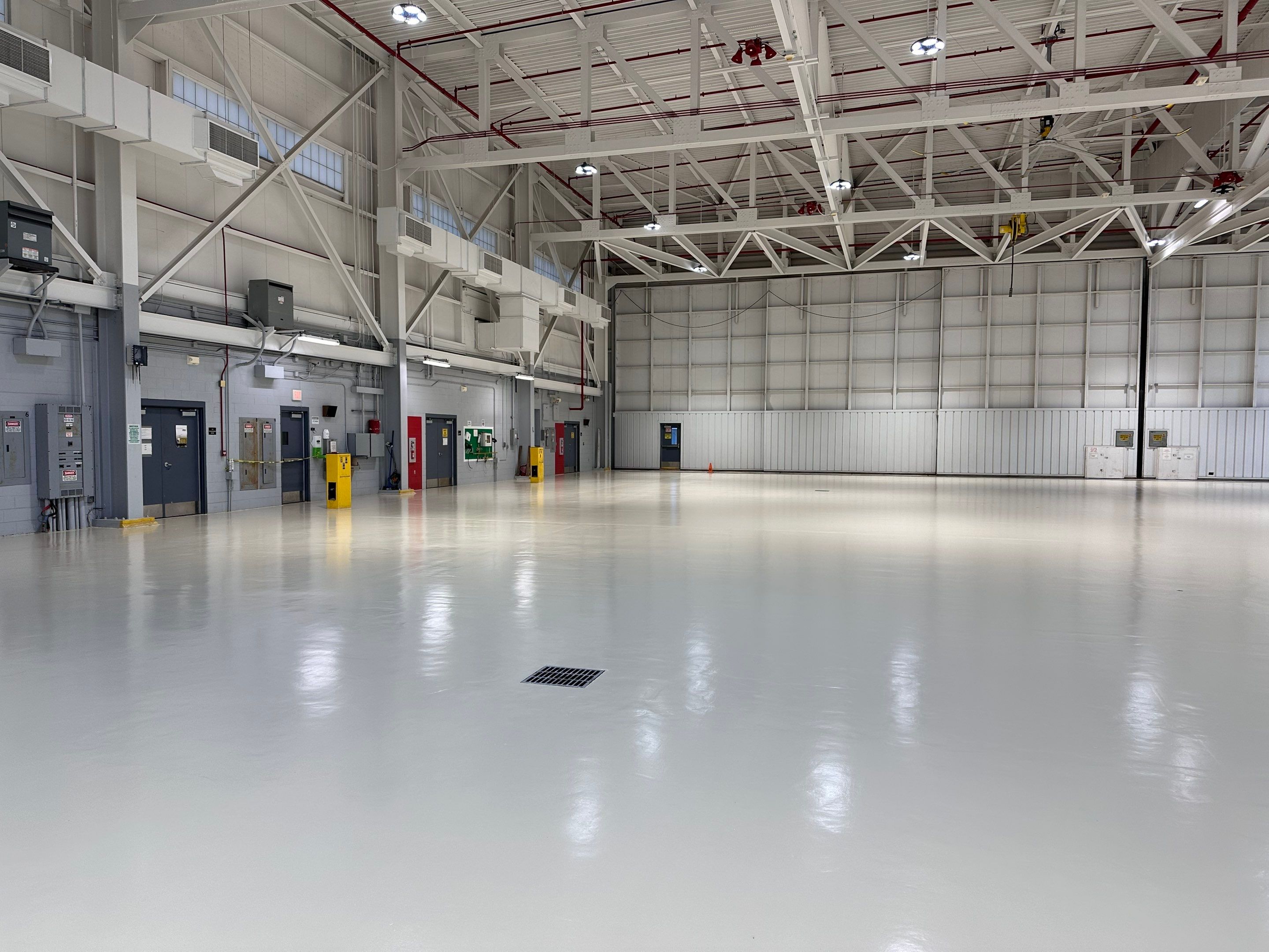 Industrial Epoxy Flooring for Army National Guard Hangar in Mobile by Cornerstone Hard Surface Restoration 