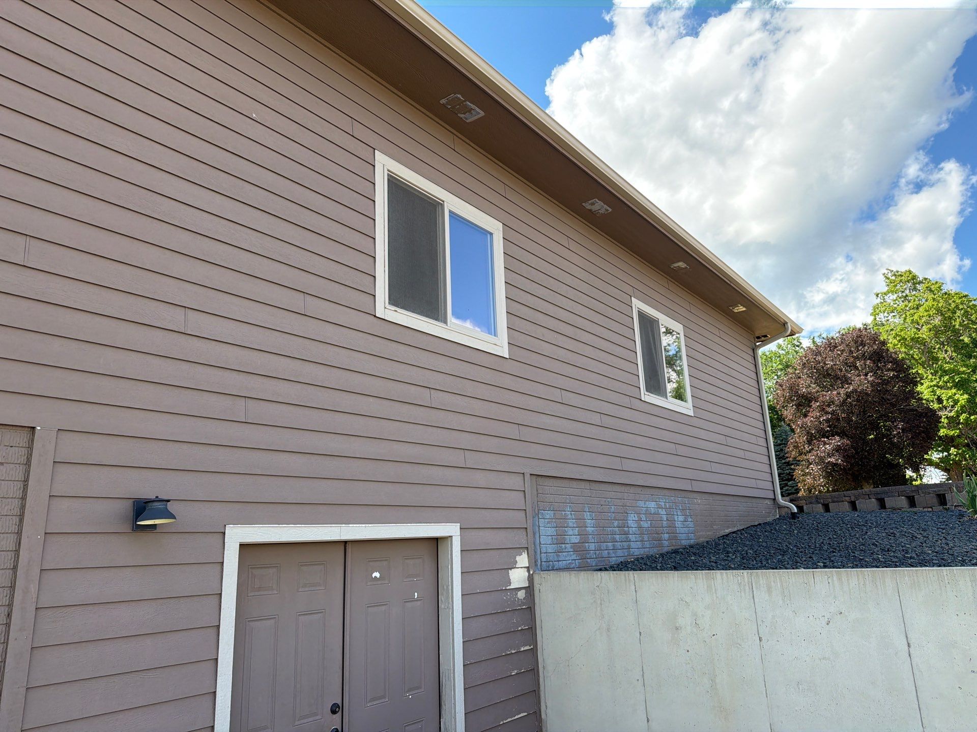 Full Exterior Siding Paint Restoration and Refresh in Garretson by Select Painting, Coatings & Garage Cabinets