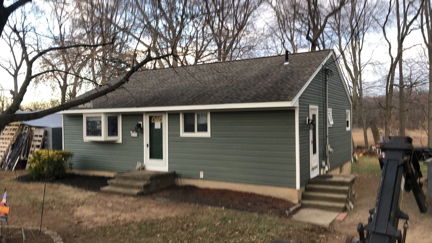 Siding Installation using Certainteed Mainstreet Forest Green by A Plus Exterior