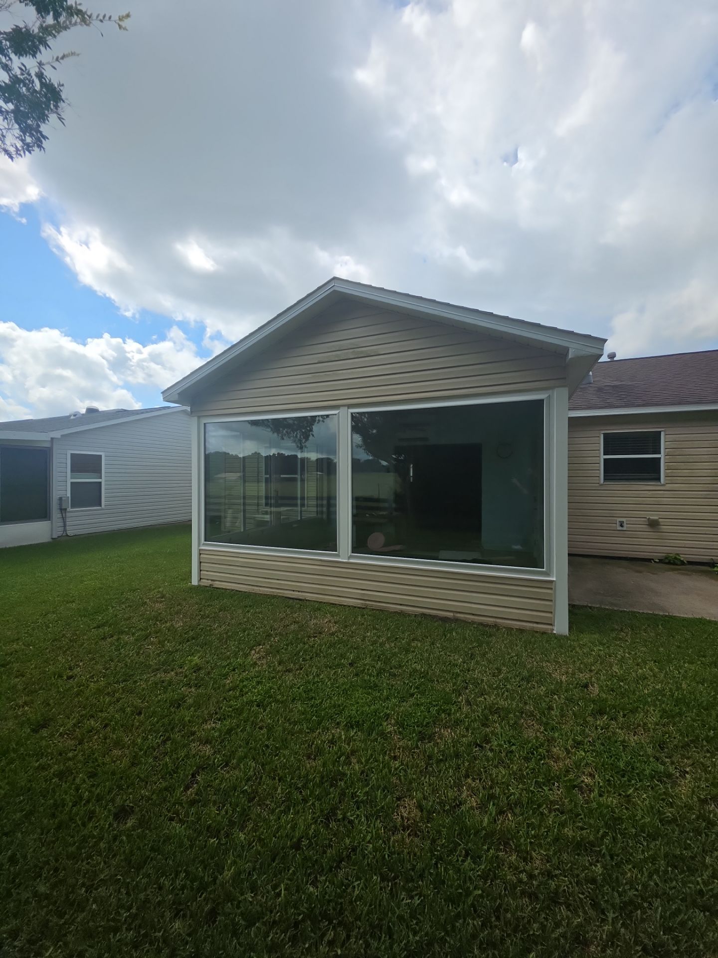Sunroom Conversion with Alside Windows and Provia Door in The Villages by Windows & Doors Store