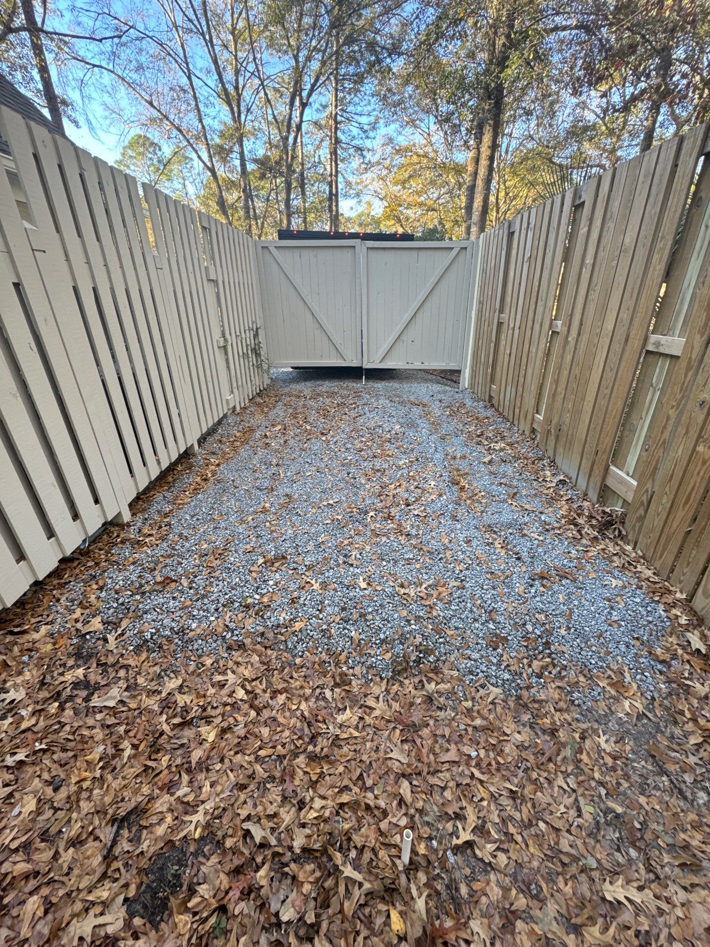 New Concrete Driveway and Privacy Fence Installation in Bluffton by Lowcountry Scapes, LLC