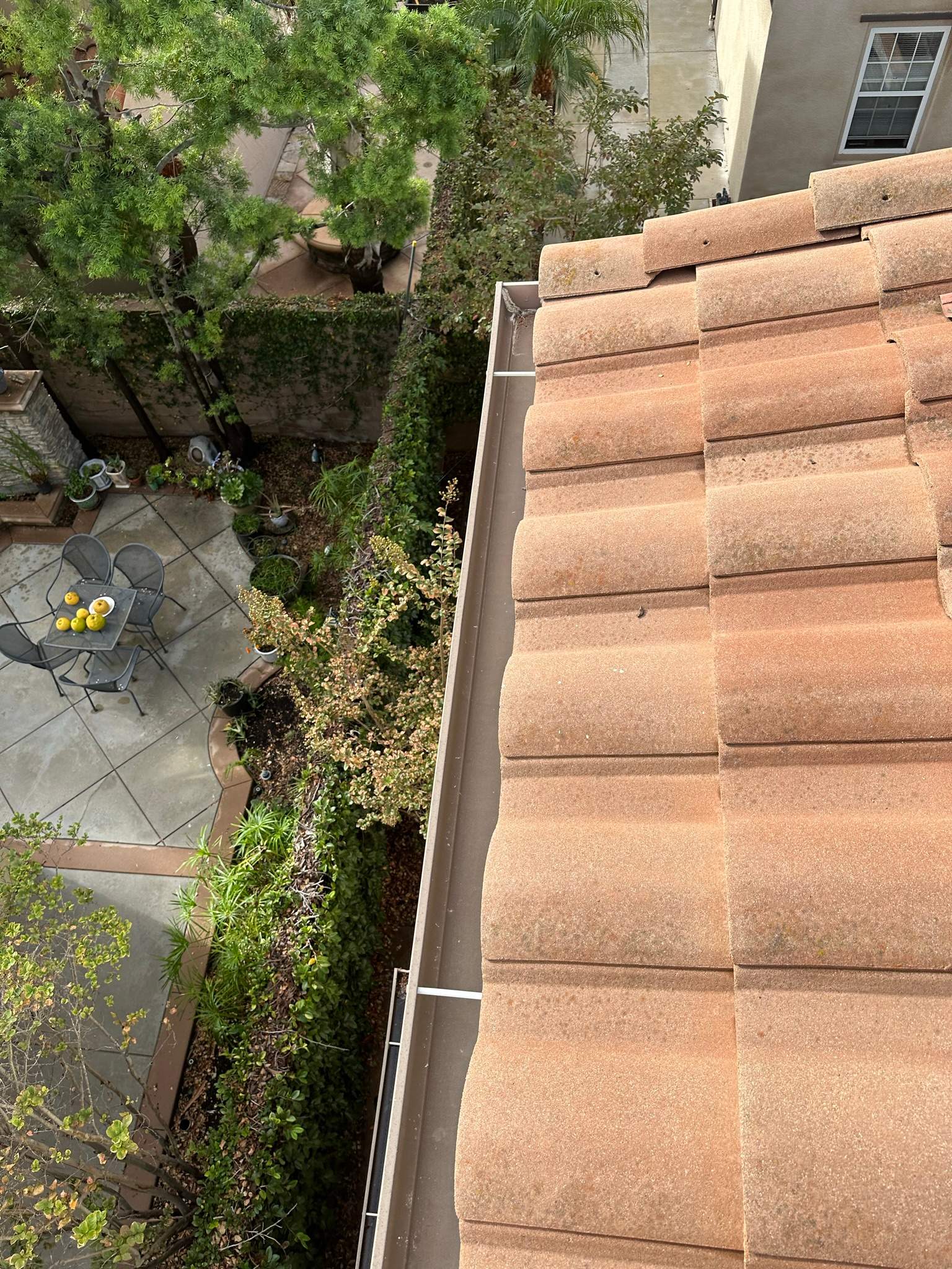 Clogged gutters at this Irvine home in Woodbury by Property Cleaning Experts, LLC