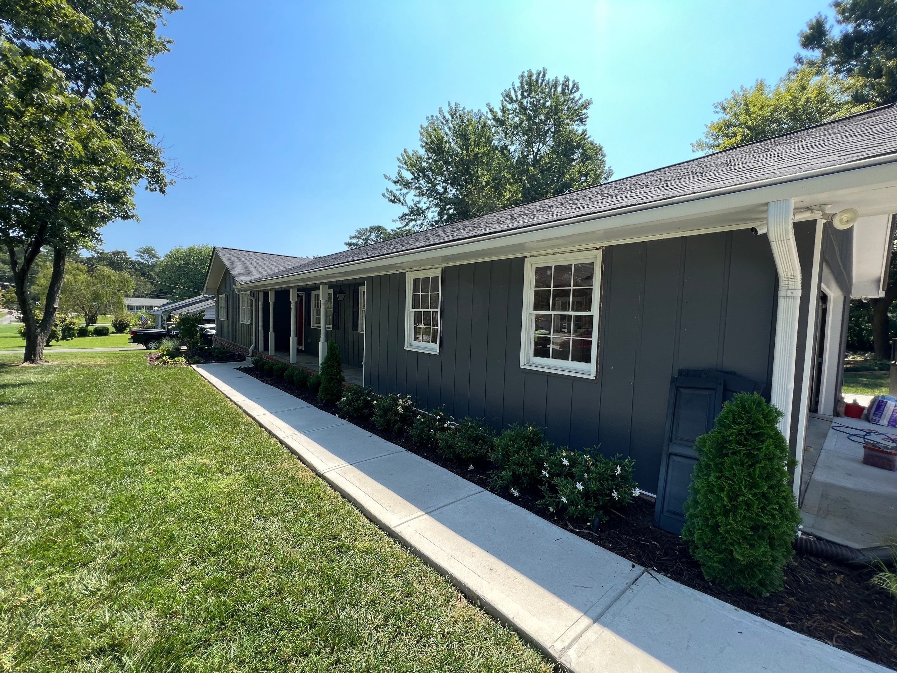 Snellville Garage Remodel Featuring Epoxy Floors and Board and Batten Siding by Swift Home Renovations