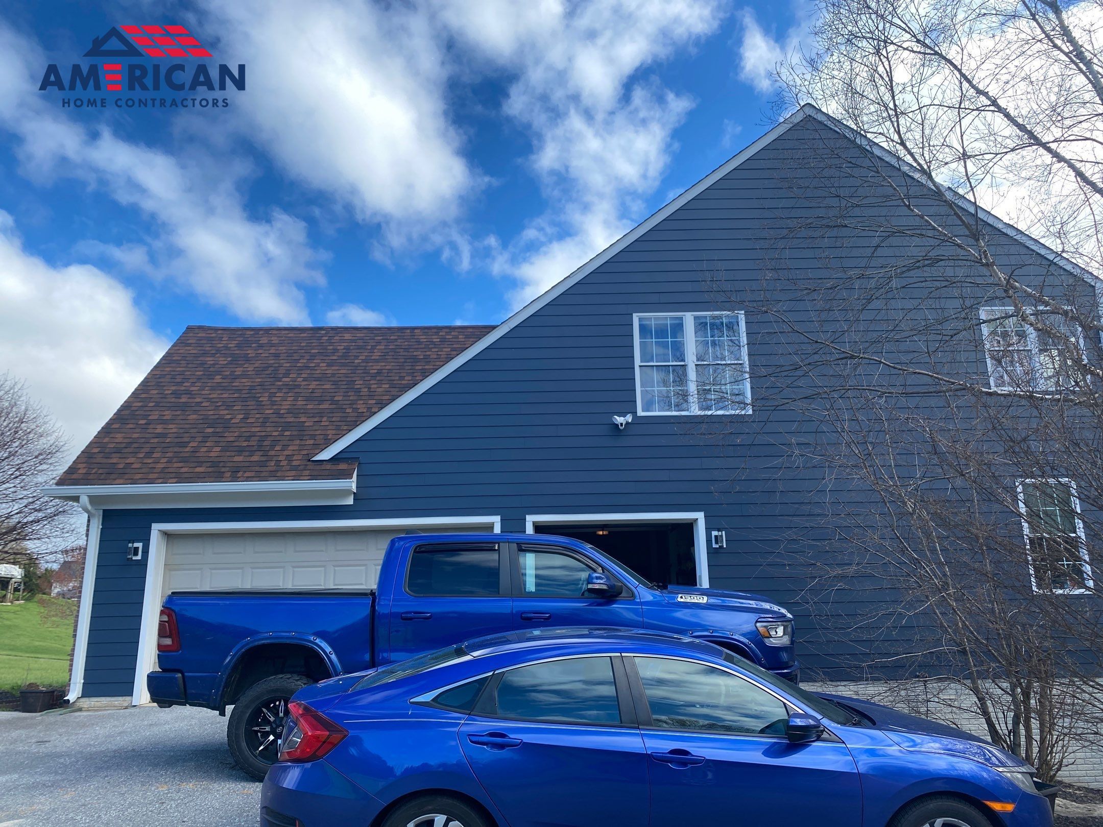 James Hardie Plank Siding + Seamless Gutters by American Home Contractors