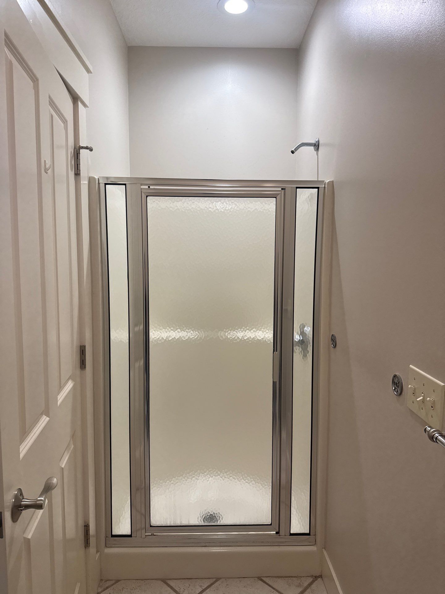 East Jordan Walk-In Shower Remodel with Folding Bench and Chrome Fixtures by Rainbow Seamless Systems
