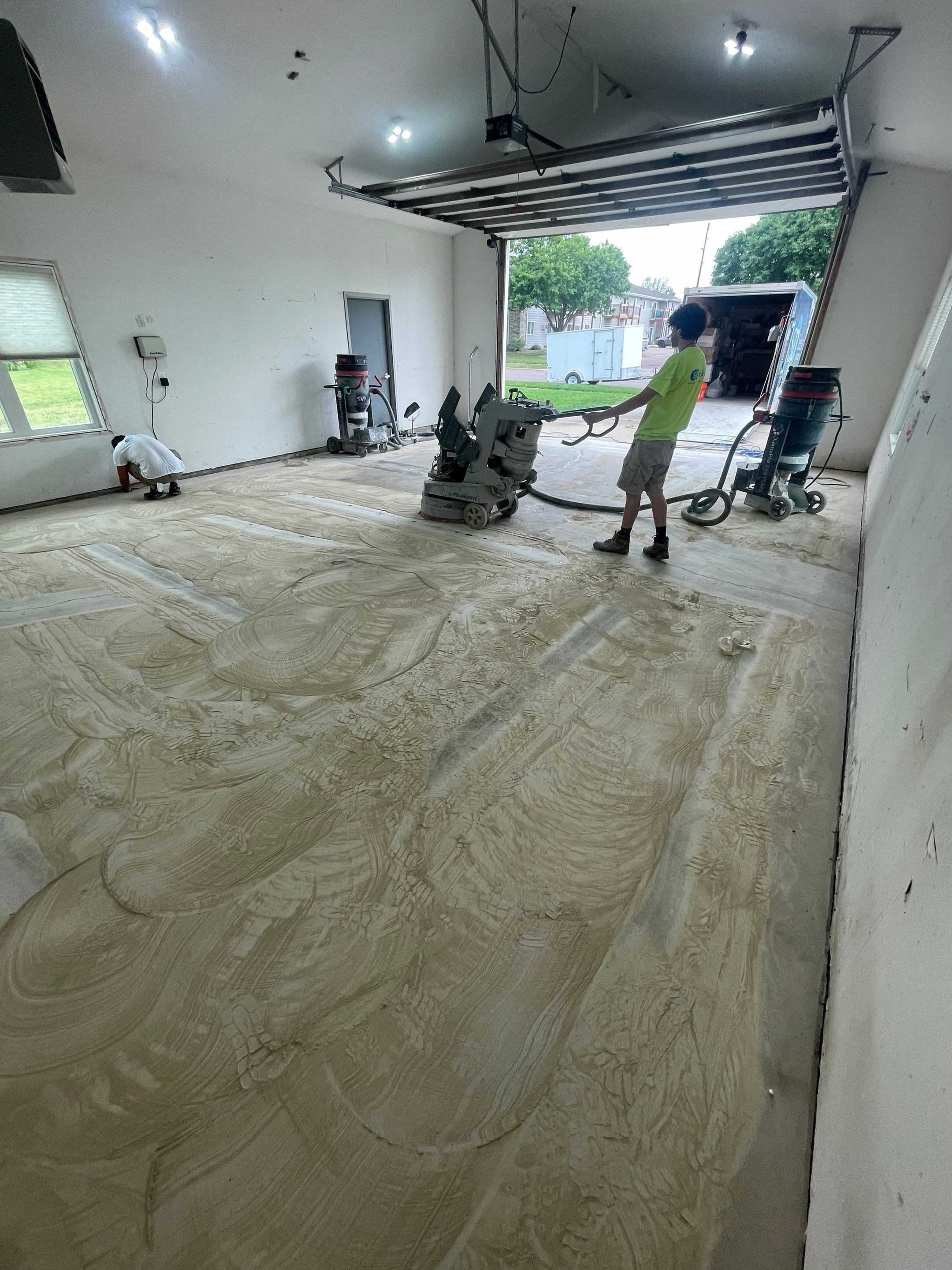 Coyote Flake Concrete Coating for Sioux Falls Garage by Select Painting, Coatings & Garage Cabinets
