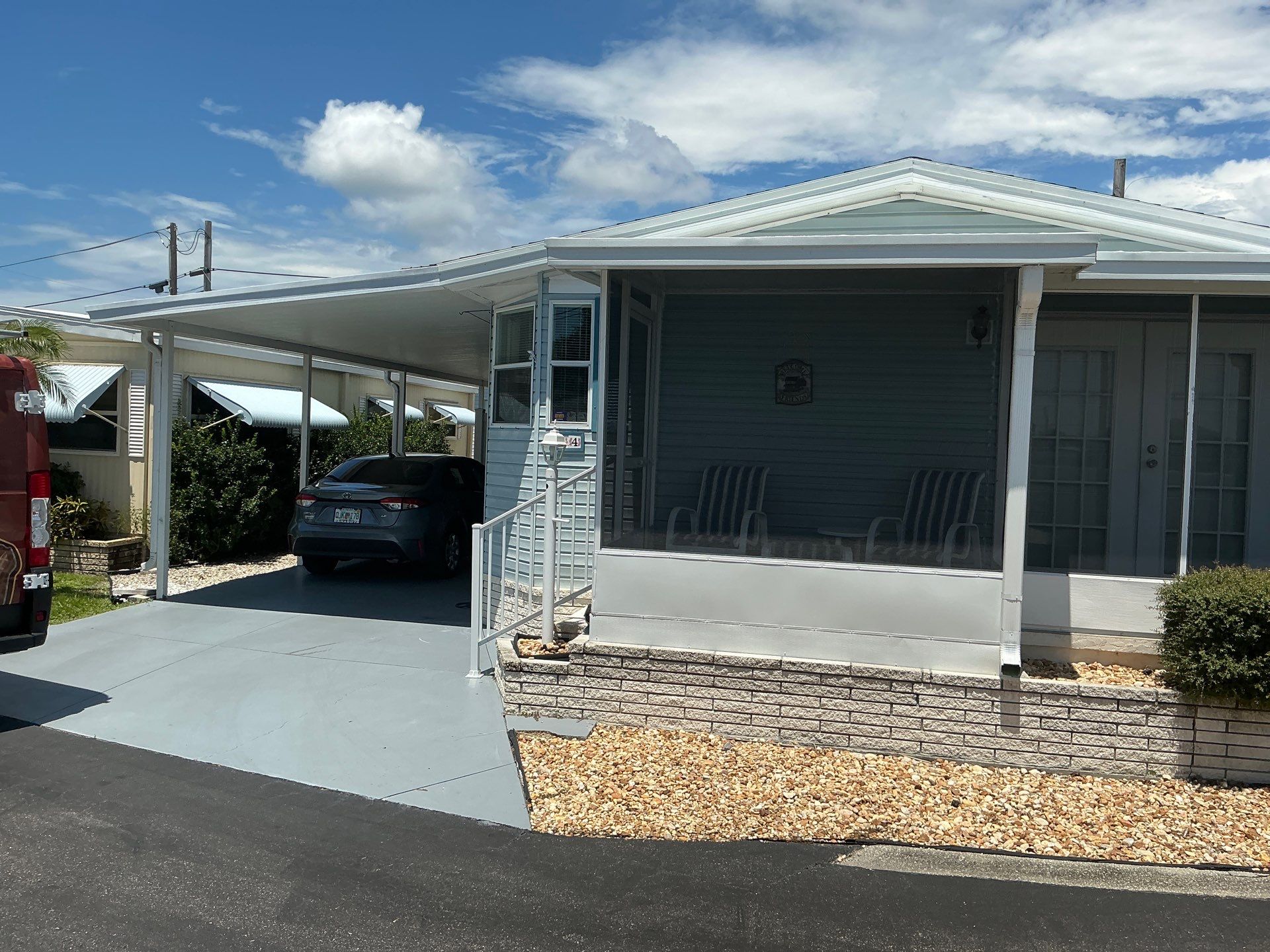 6-inch white seamless gutters in Sarasota FL by Gutter Professors
