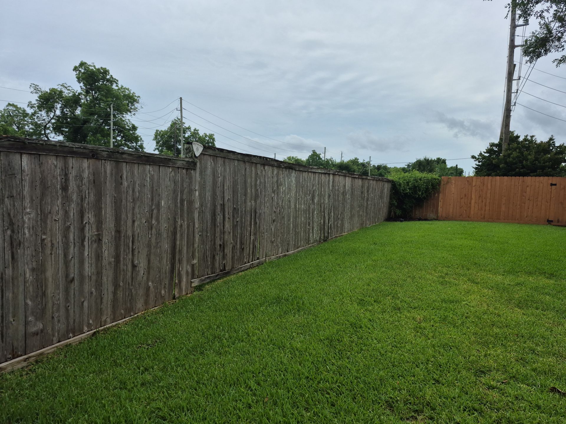 Wood Fence Installation for HOA by Tim's Fences