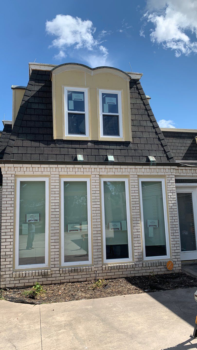 Mansard Charm by Bayfront Roofing and Construction