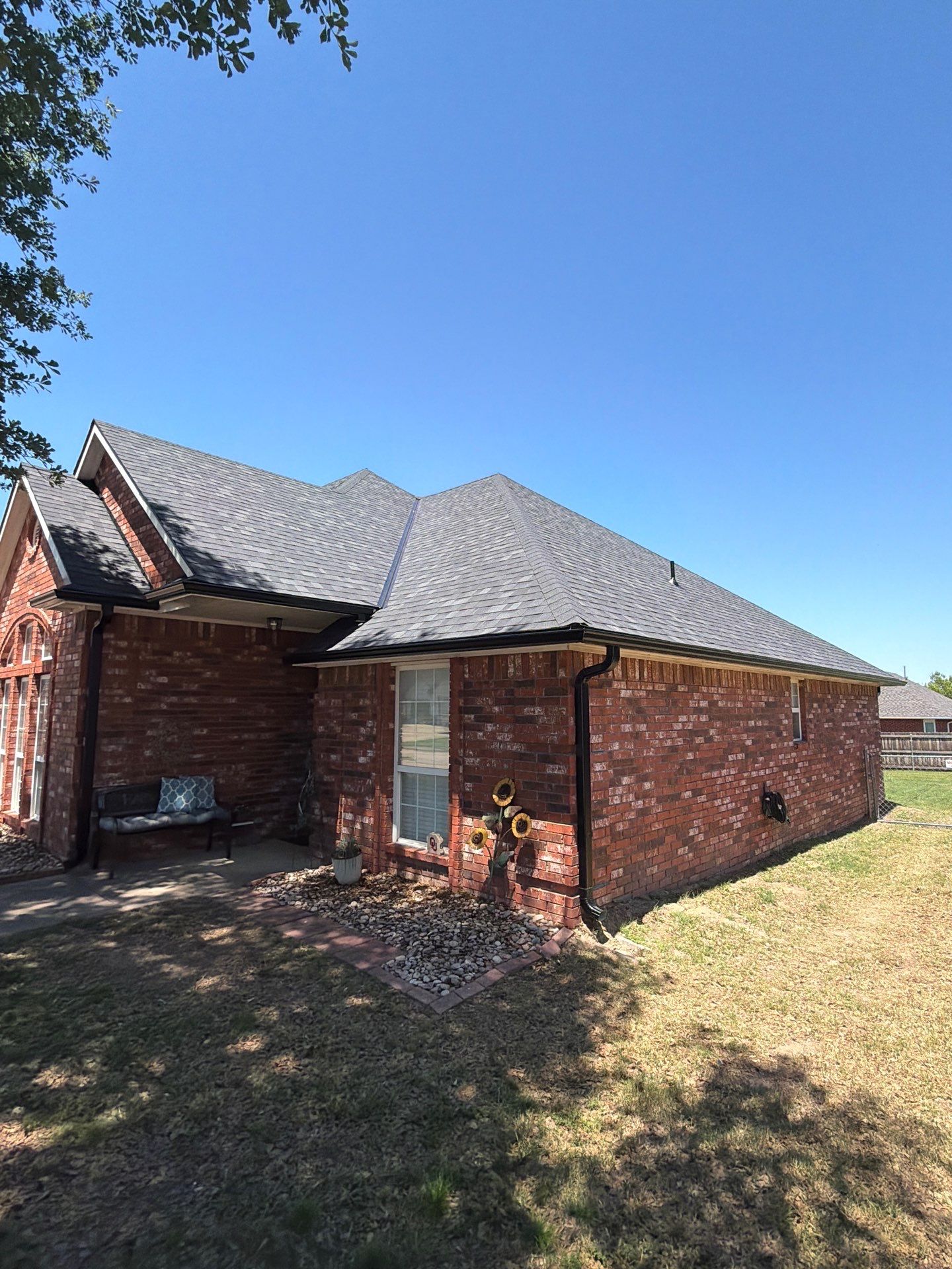 Black roof & gutters!! by In & Out Construction & Remodeling, LLC