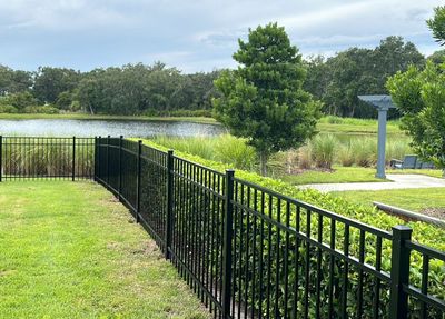 Aluminum Fence Installation using Black 3 Rail Aluminum Fence