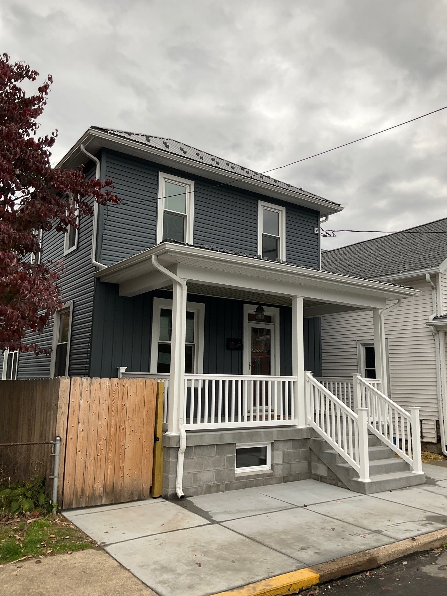 Charcoal Metal Roof & Blue Siding — A Refreshing New Look by Esh Builders