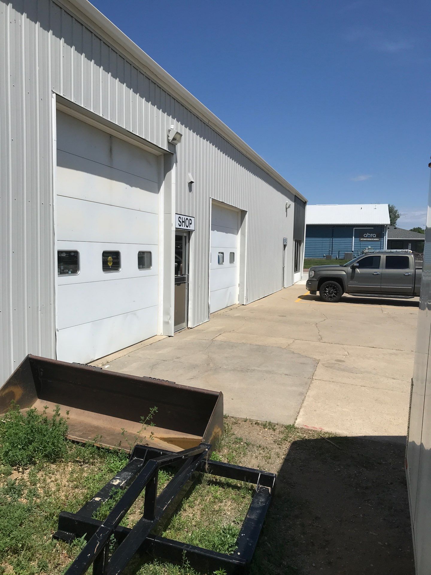 Commercial Shop Renovation and Concrete Parking Installation in Brookings by Select Painting, Coatings & Garage Cabinets