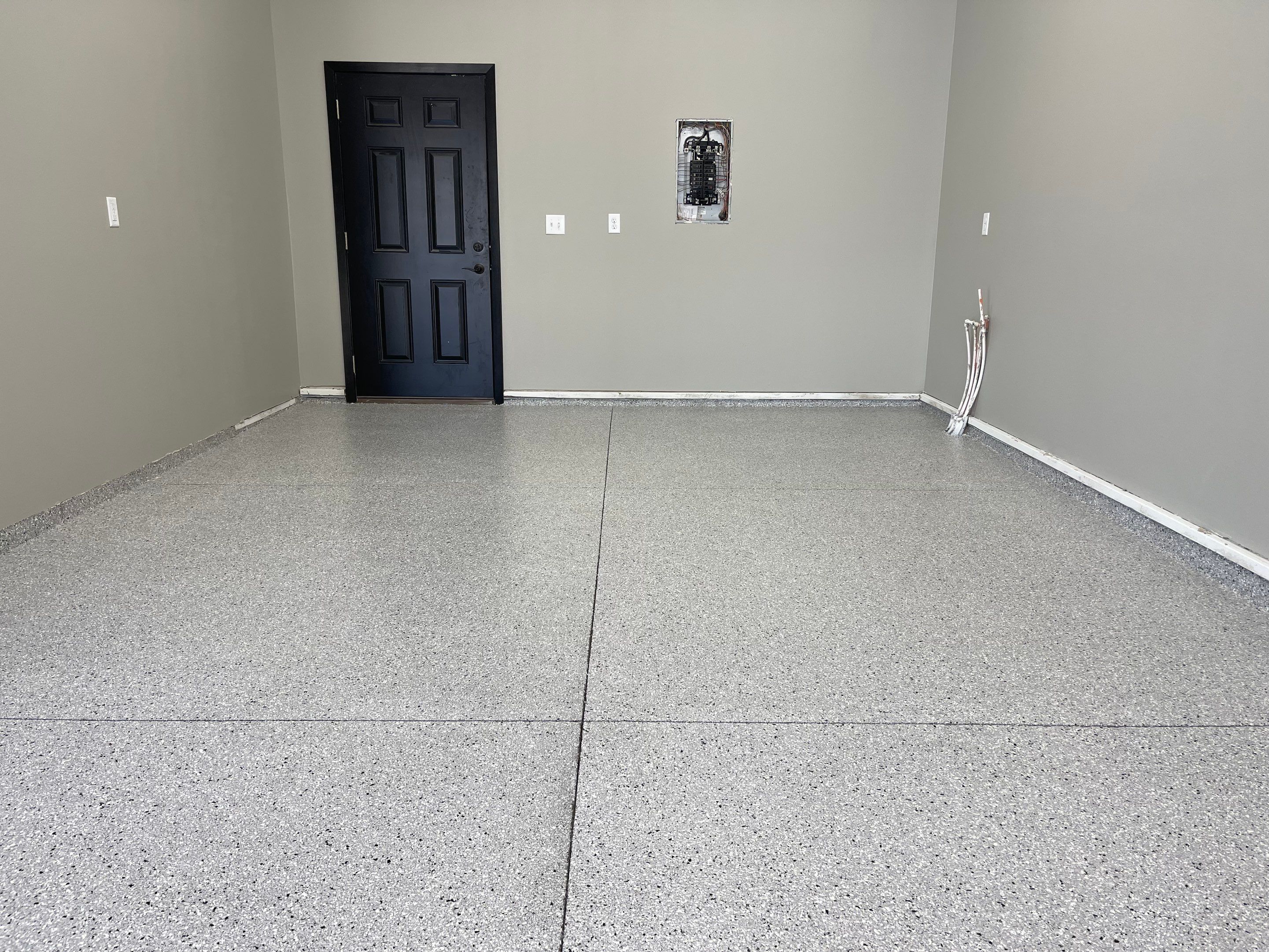 Decorative Flake Concrete Coating Installation in North Sioux City by Select Painting, Coatings & Garage Cabinets