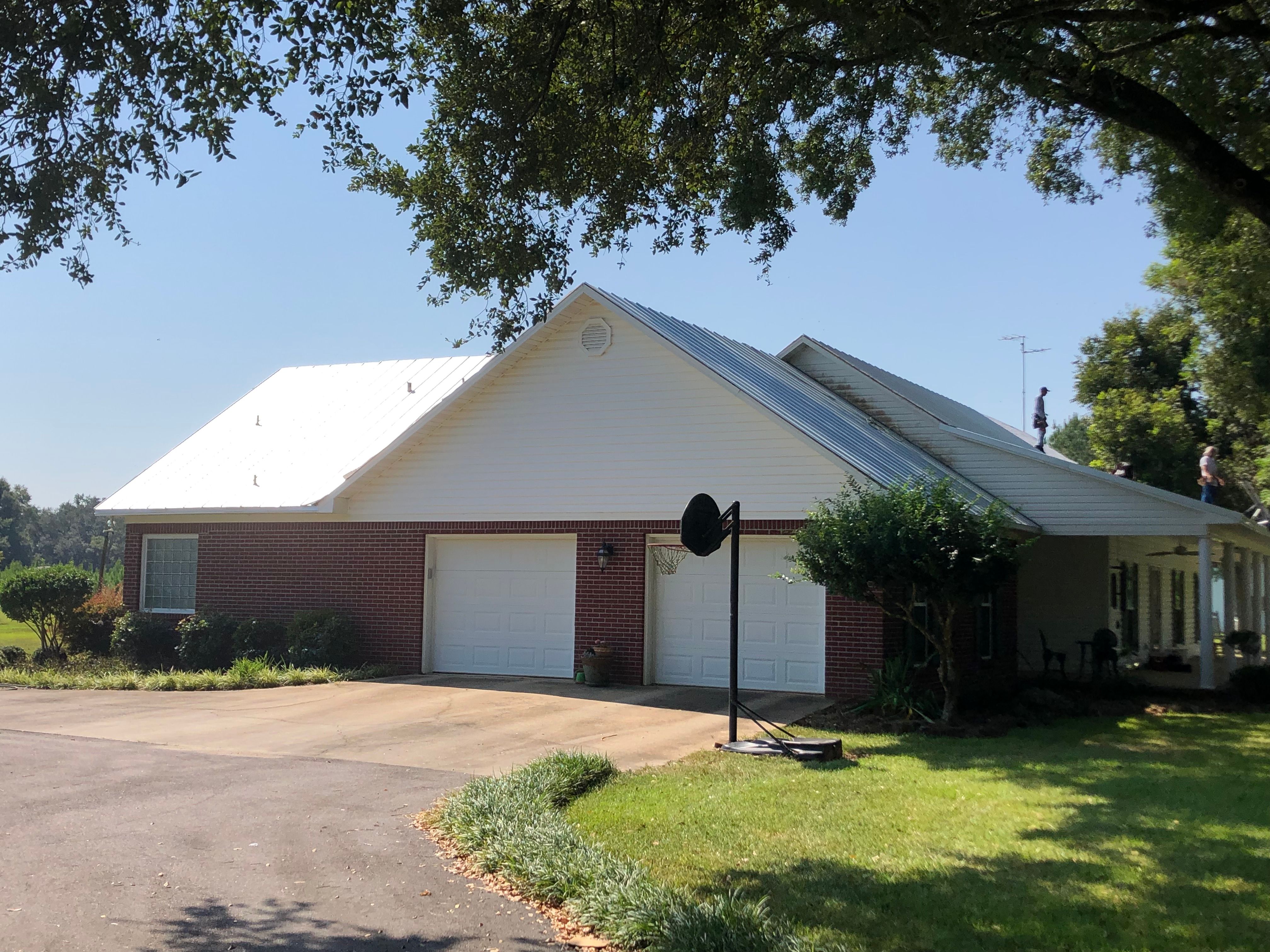 Residential Roofing Installation using Metal roofing by American Roofing & Construction LLC