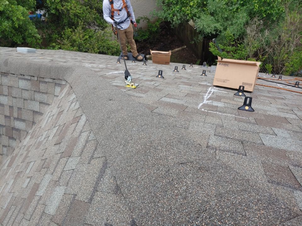 Residential Roof Replacement and Solar Panel Integration in Austin by Caliber Restoration LLC