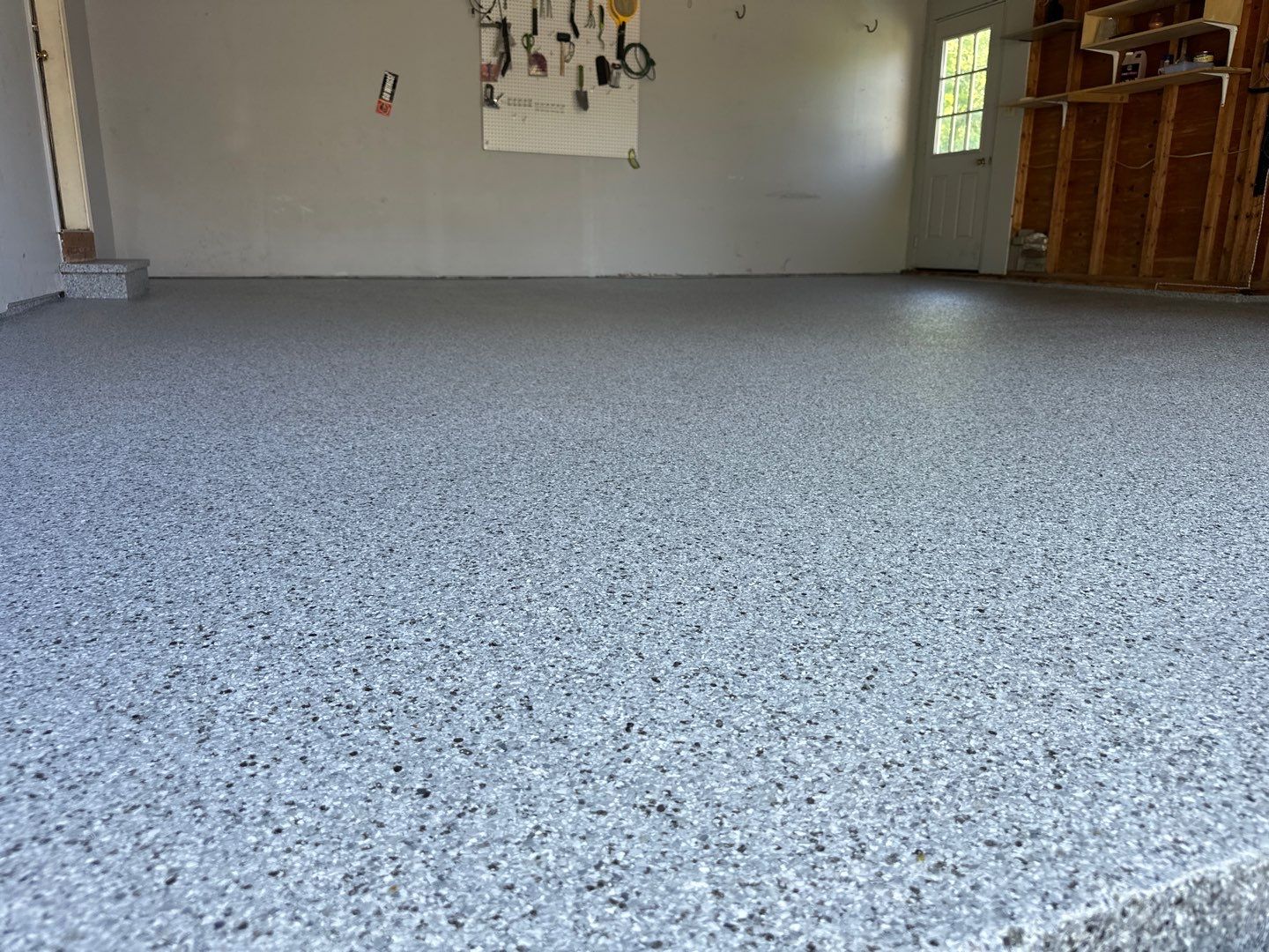 Silverado garage floor coating  by NG Masonry & Construction LLC