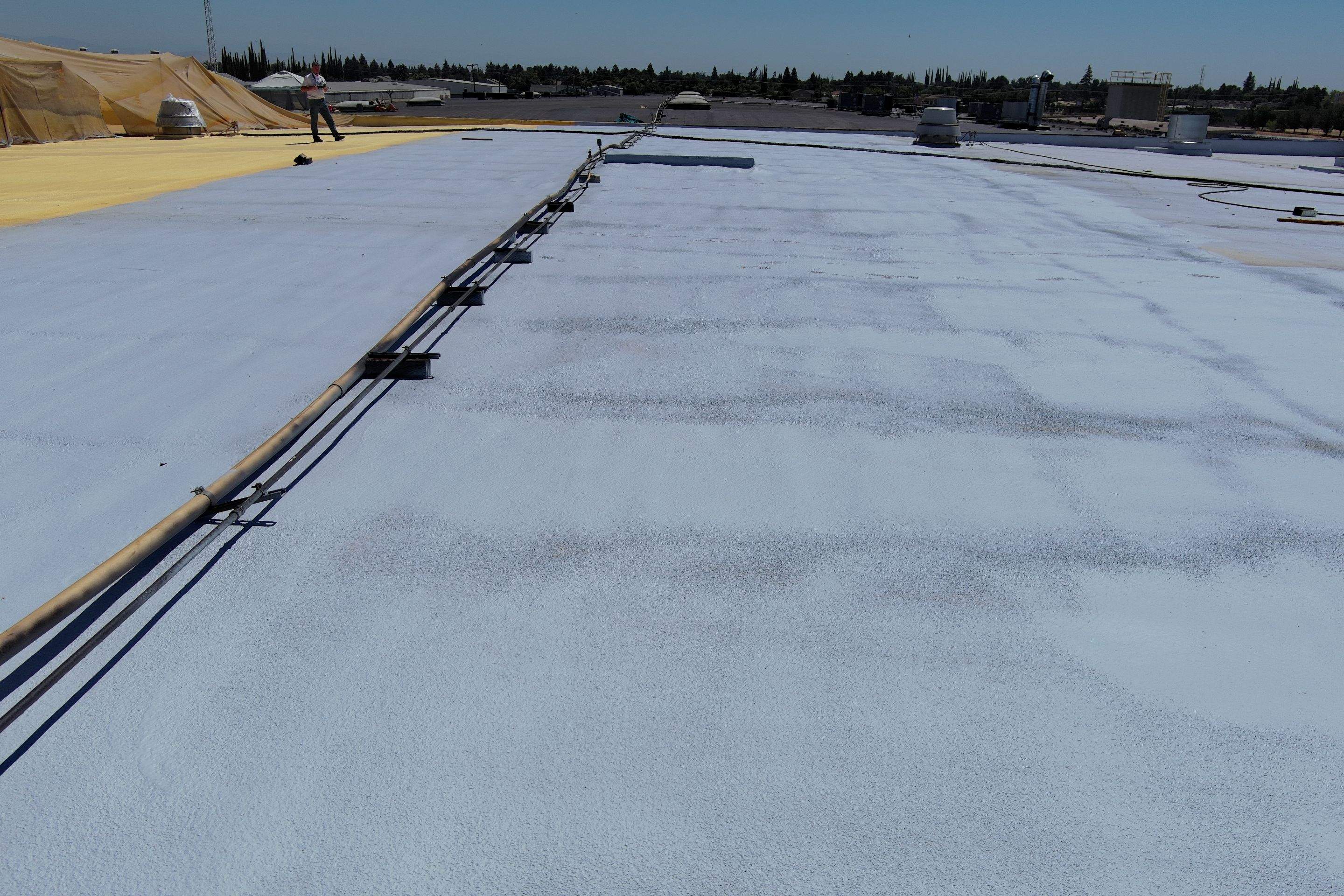 Pro Farms Spray foam roofing project by Straight Edge Roofing Inc