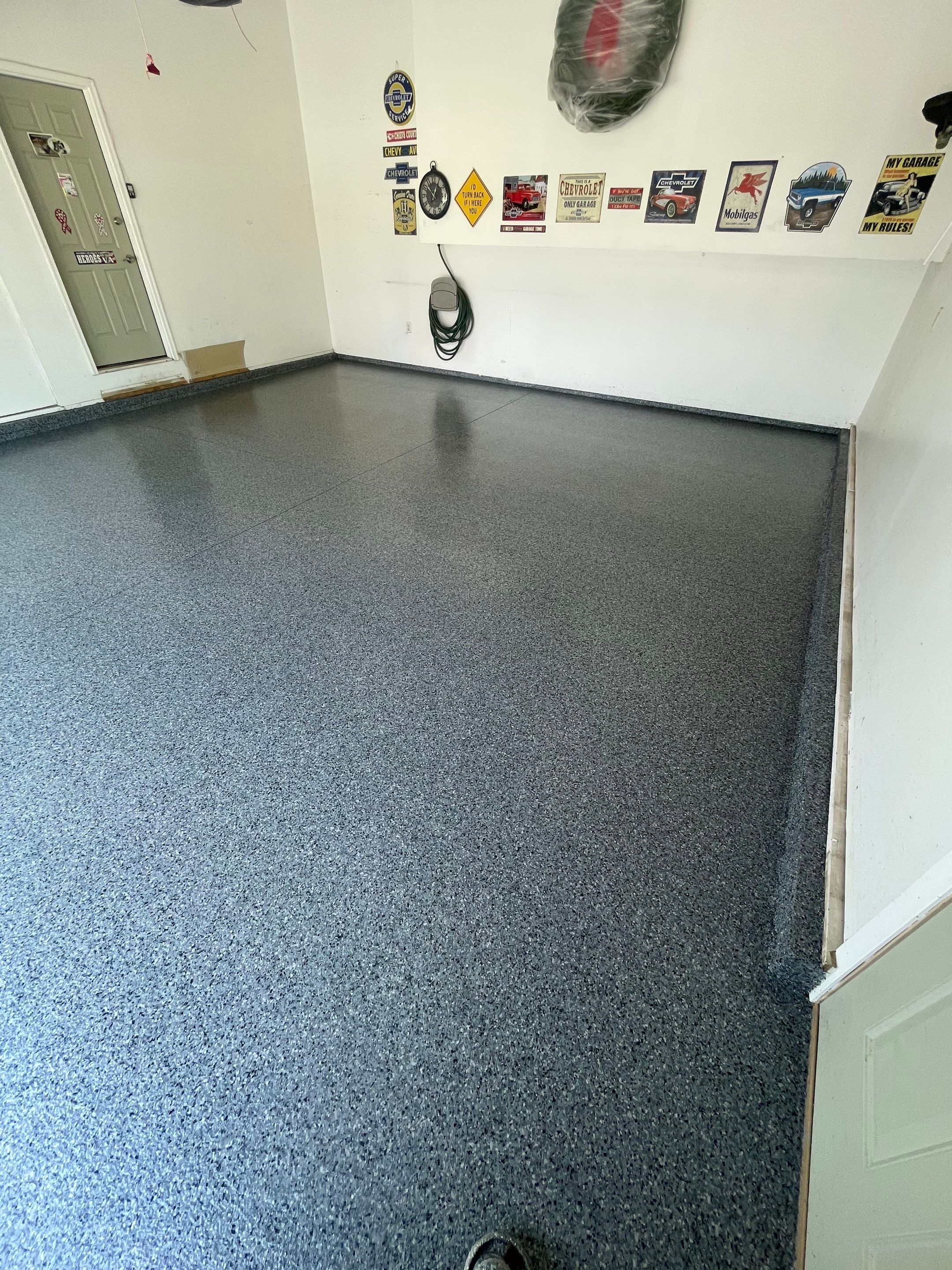 Sioux Falls Garage Floor Coating with Nightfall Decorative Chips by Select Painting, Coatings & Garage Cabinets
