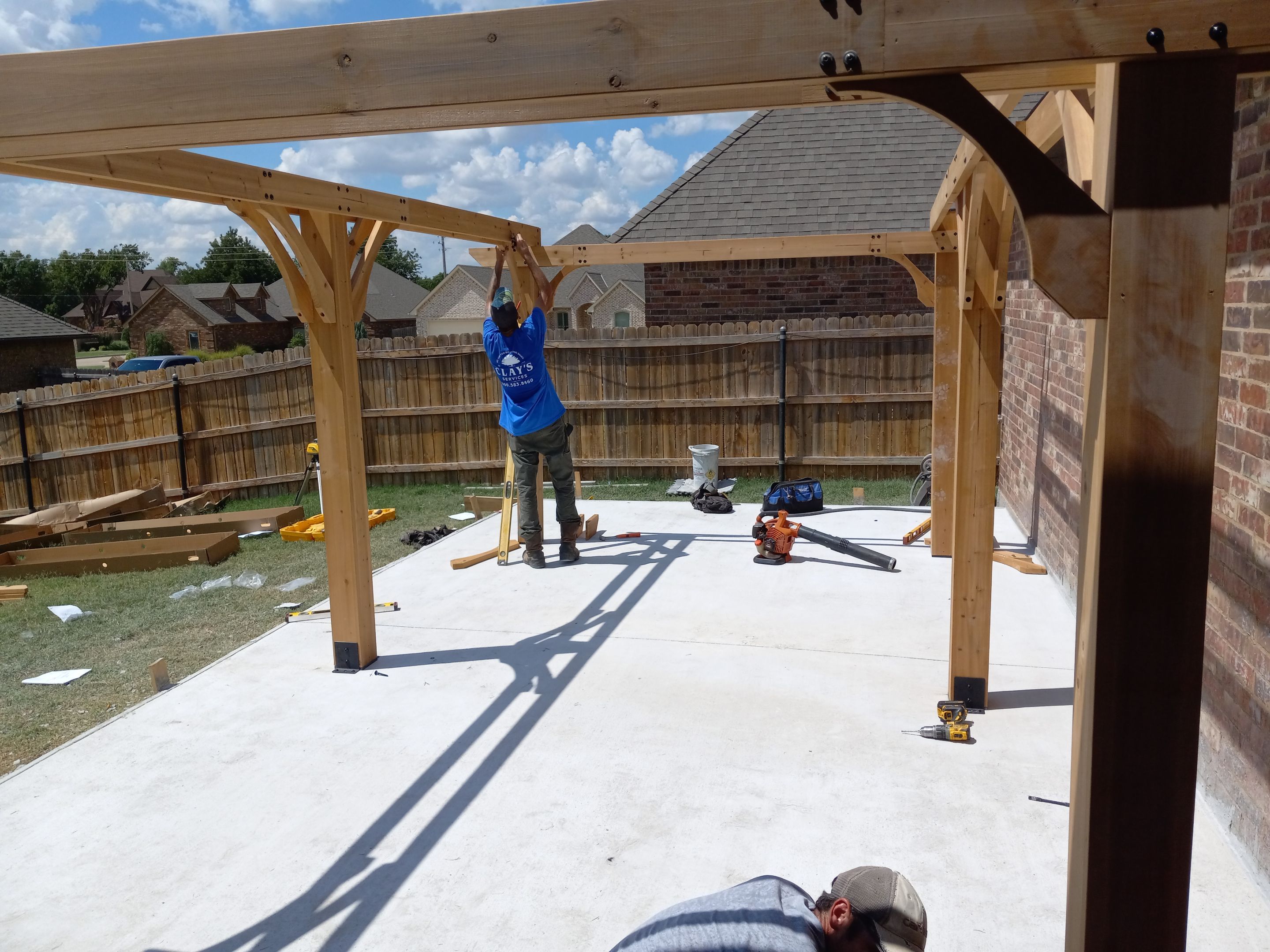 Concrete slab with Pergola by Clays Services Inc