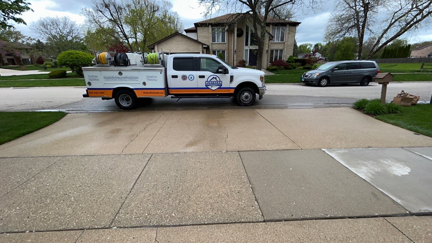 concrete patio and driveway cleaning by Northern Power Washing LLC.