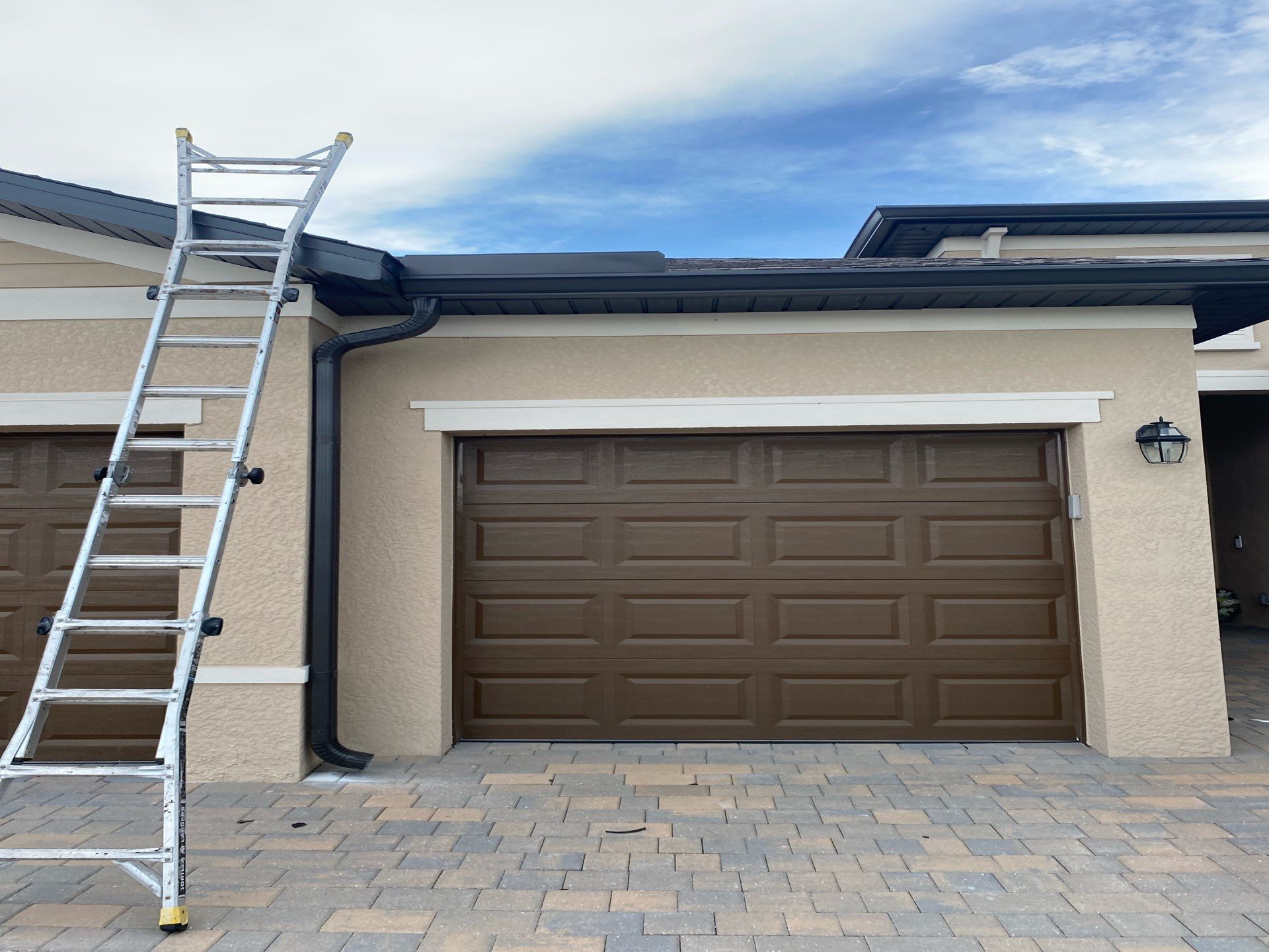 Brown Seamless Gutters for Homes in Fort Myers by Gutter Professors